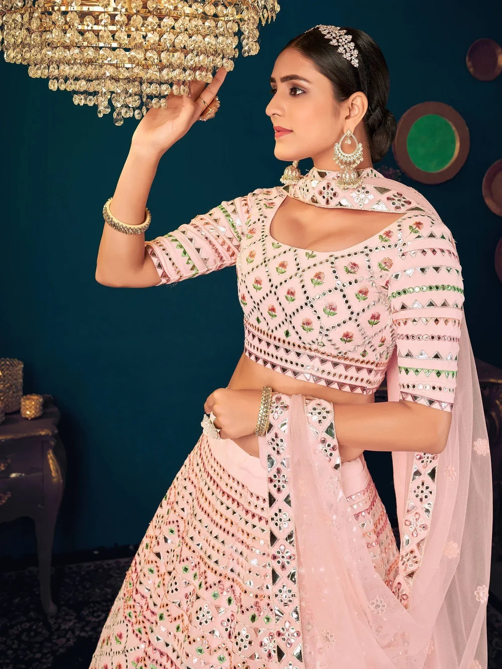 Elegant pink lehenga choli with mirror work and floral embroidery, perfect for Indian ethnic wear.