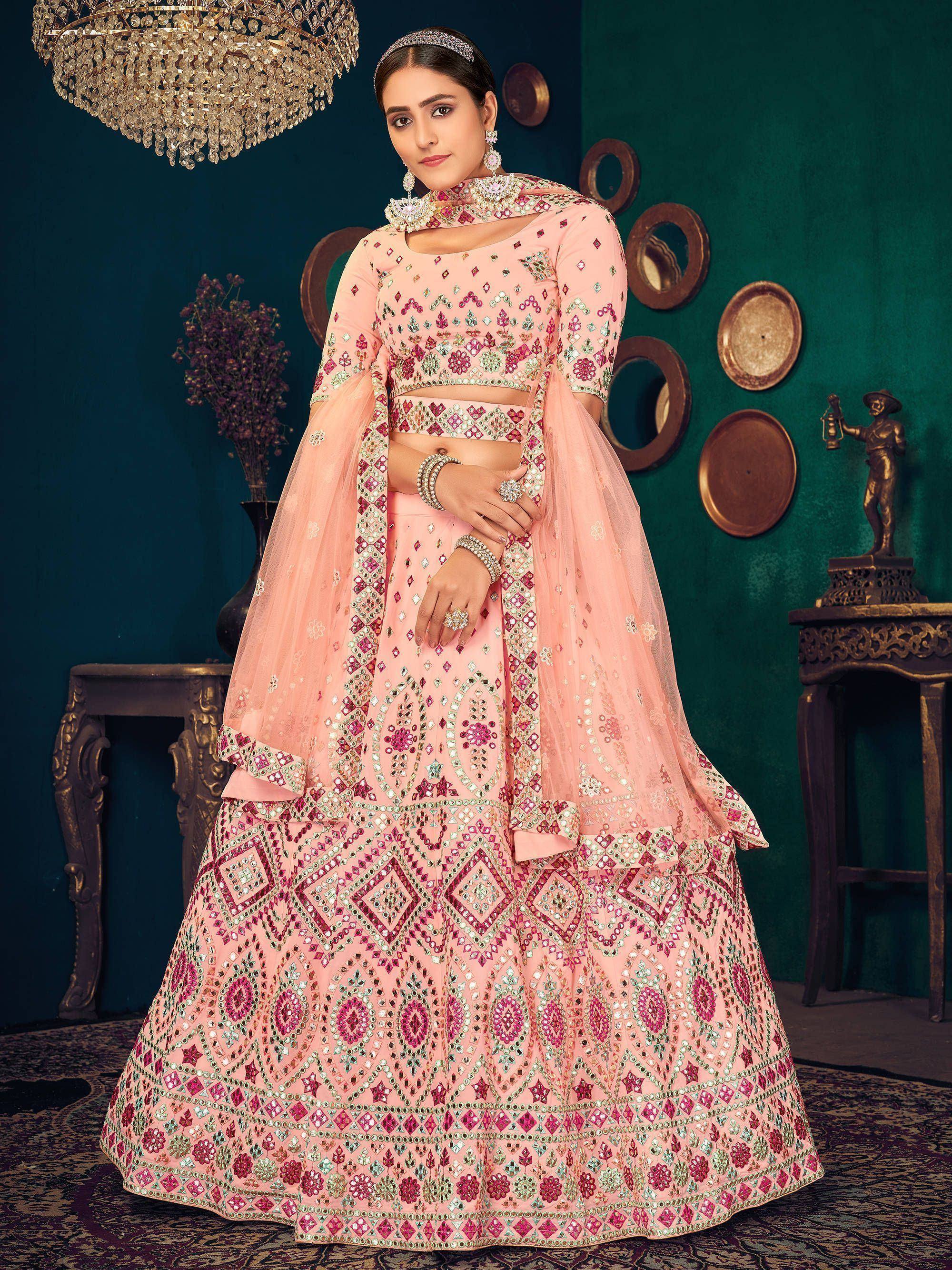 Pink designer lehenga choli with mirror work and embroidery, perfect for weddings and festive occasions