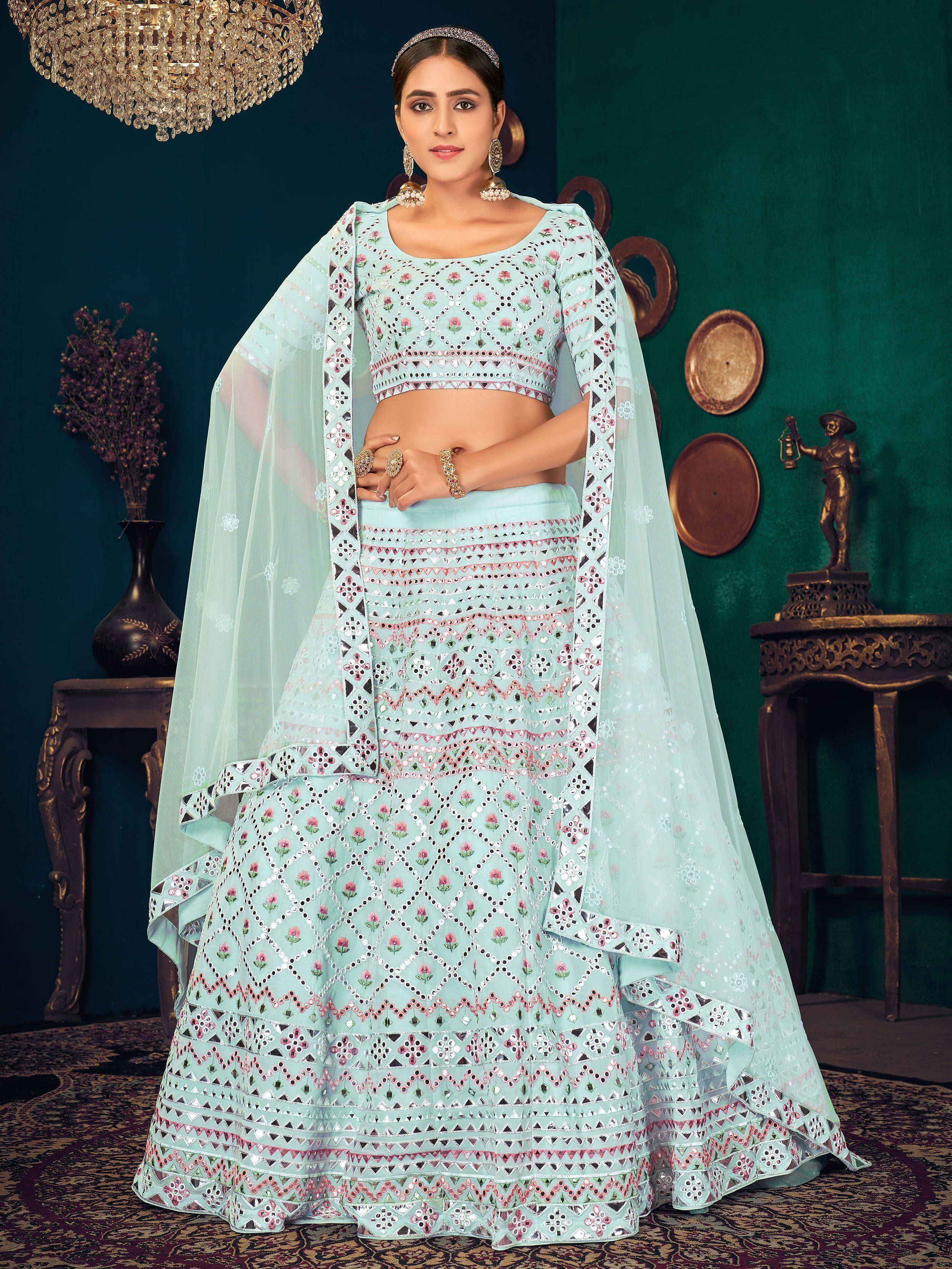 Mint green designer lehenga choli with mirror work and floral embroidery, perfect for Indian ethnic wear occasions