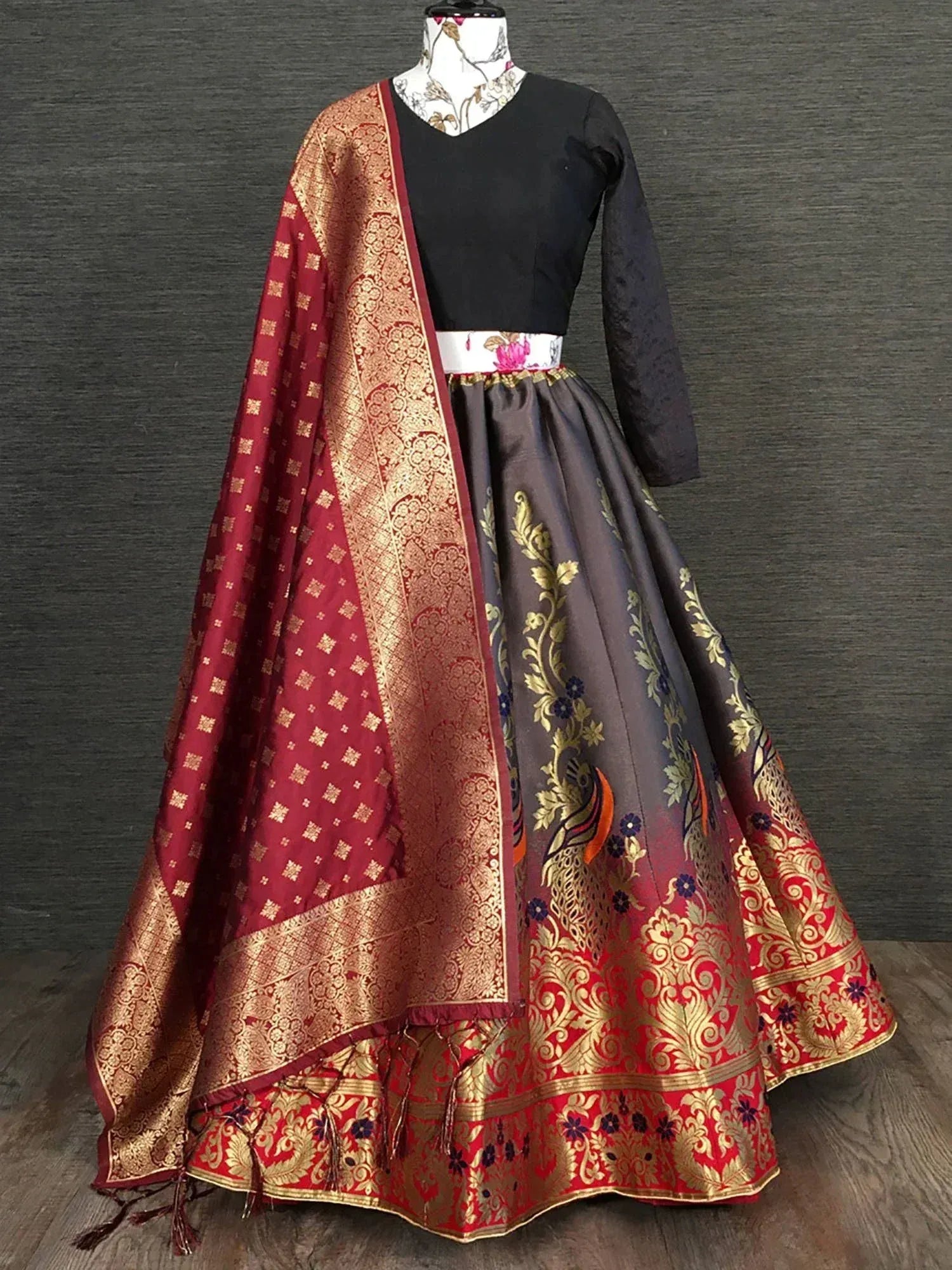 Black and maroon designer lehenga choli with gold embroidery and peacock motifs, perfect for Indian ethnic wear