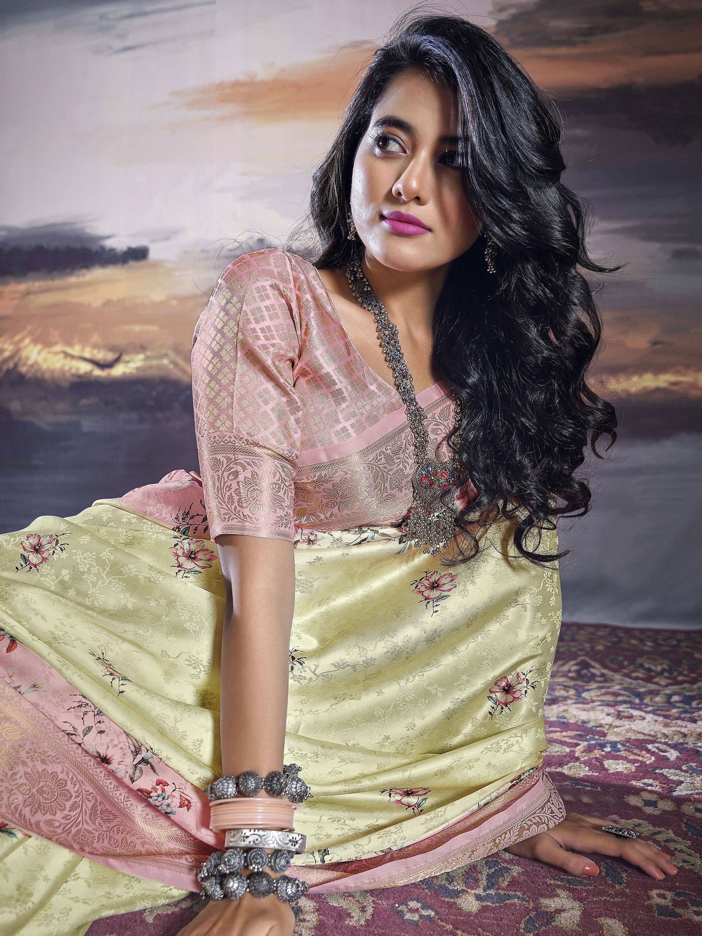 Woman in elegant yellow floral saree with pink blouse, traditional Indian ethnic wear