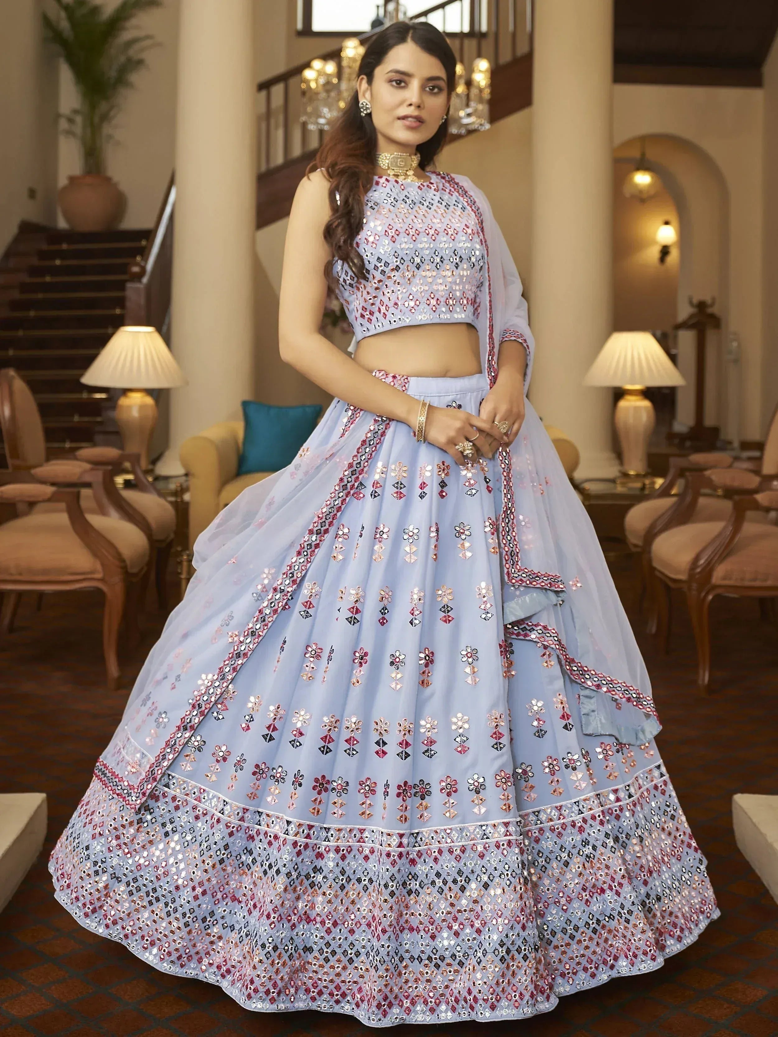 Light blue designer lehenga choli with mirror work and floral embroidery for Indian ethnic wear