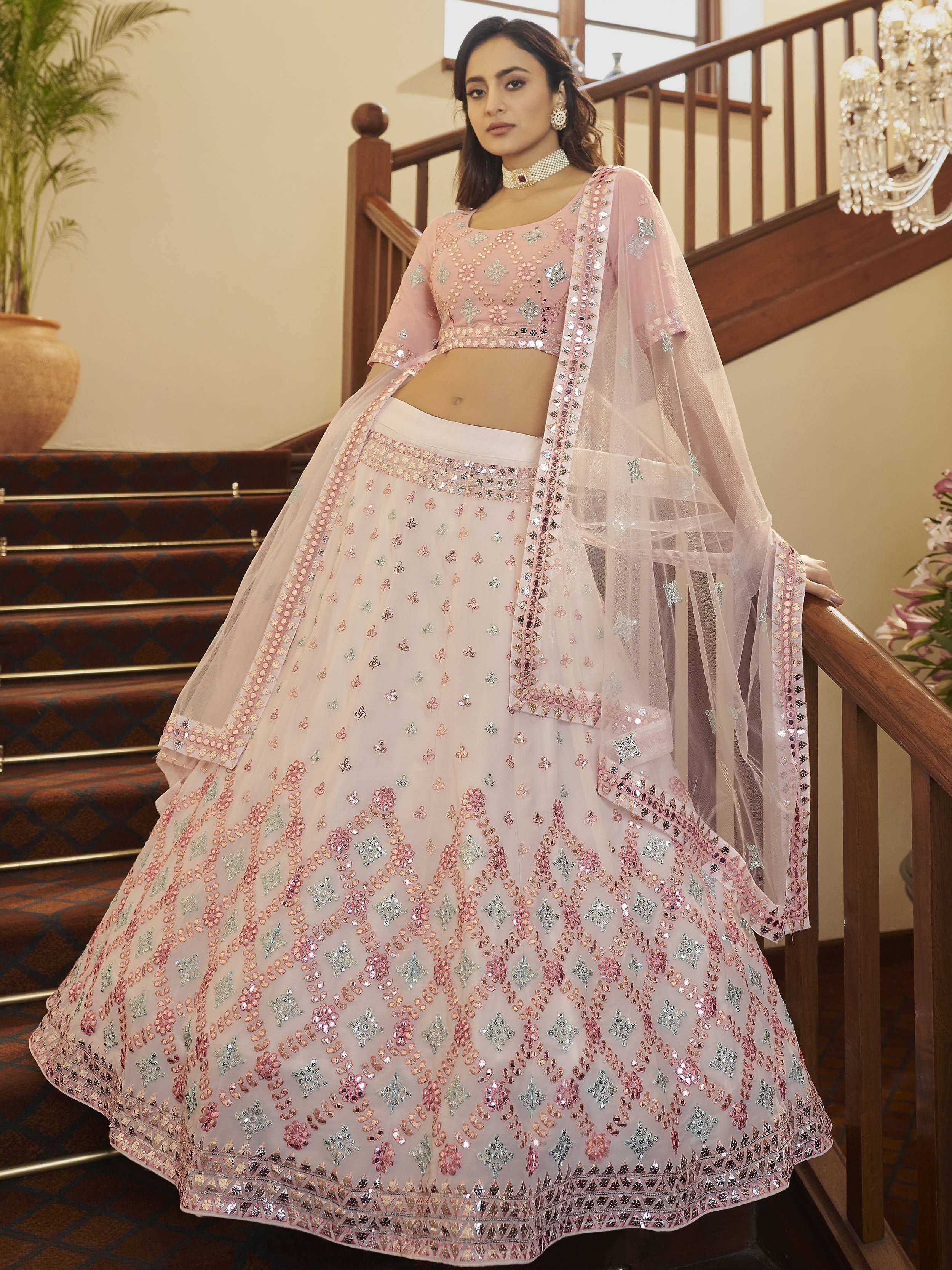 Pink floral embroidered lehenga choli with mirror work, perfect for Indian weddings and festive occasions