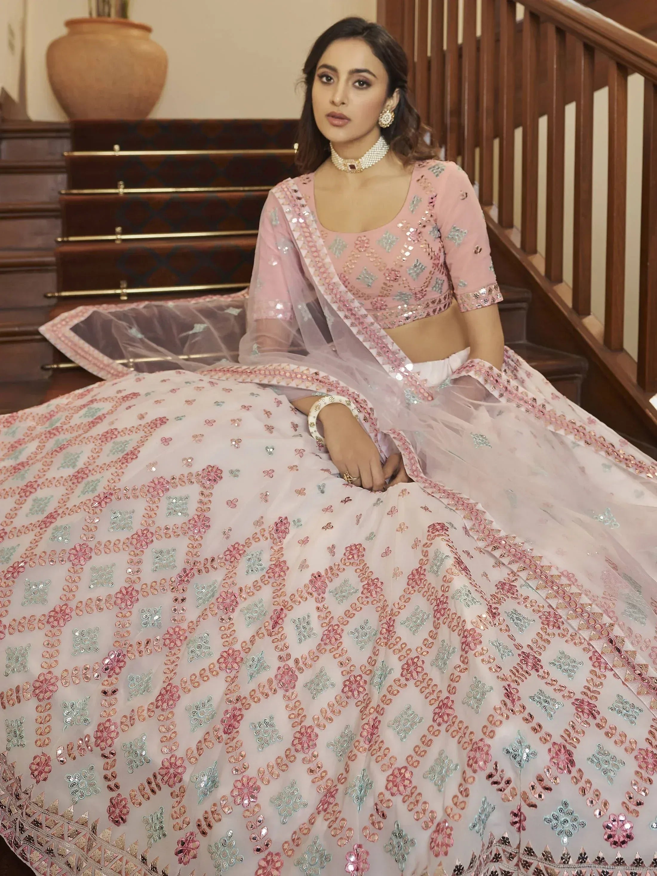 Pink floral embroidered lehenga choli with sequin work, perfect for Indian weddings and festive occasions.