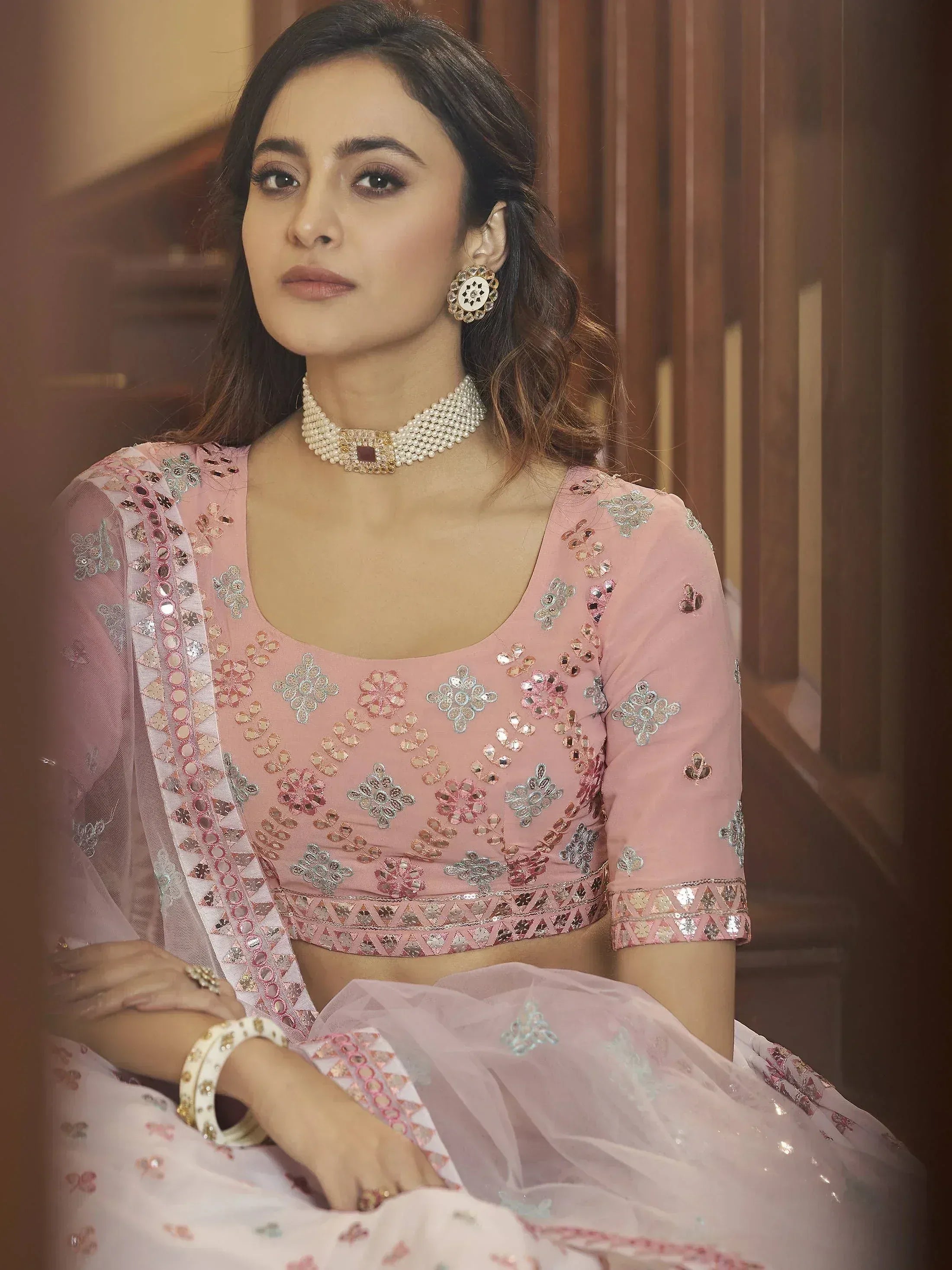Pink embroidered lehenga choli with mirror work, perfect for Indian ethnic wear and festive occasions