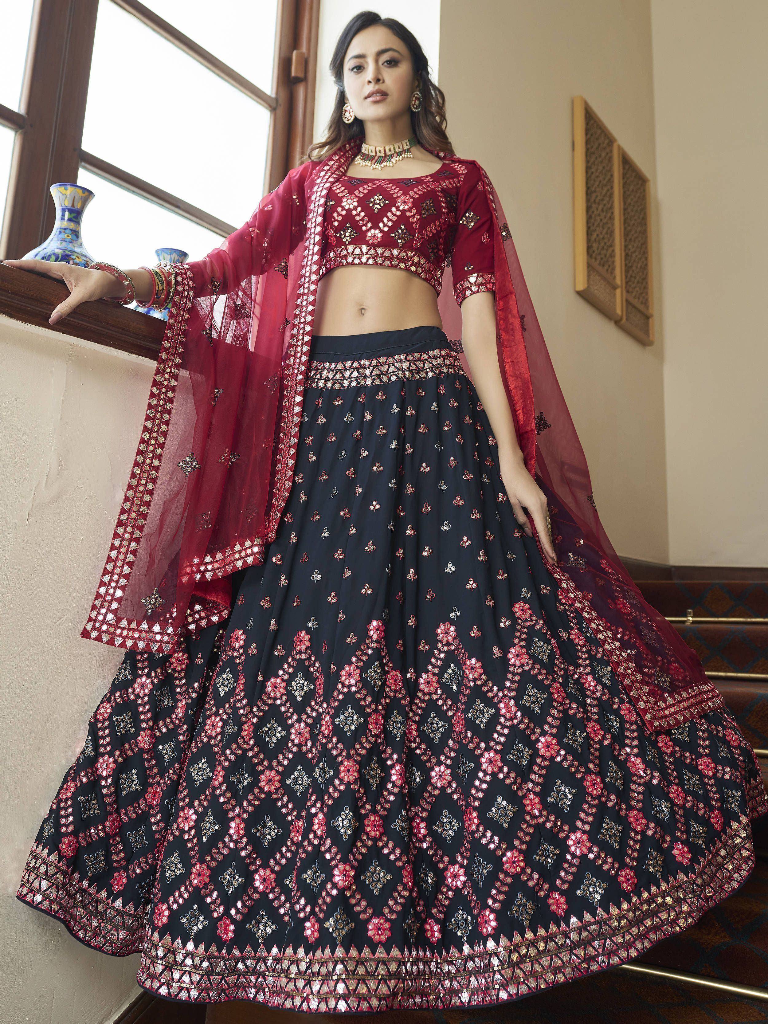 Maroon and navy blue embroidered lehenga choli with floral mirror work, perfect for Indian ethnic occasions