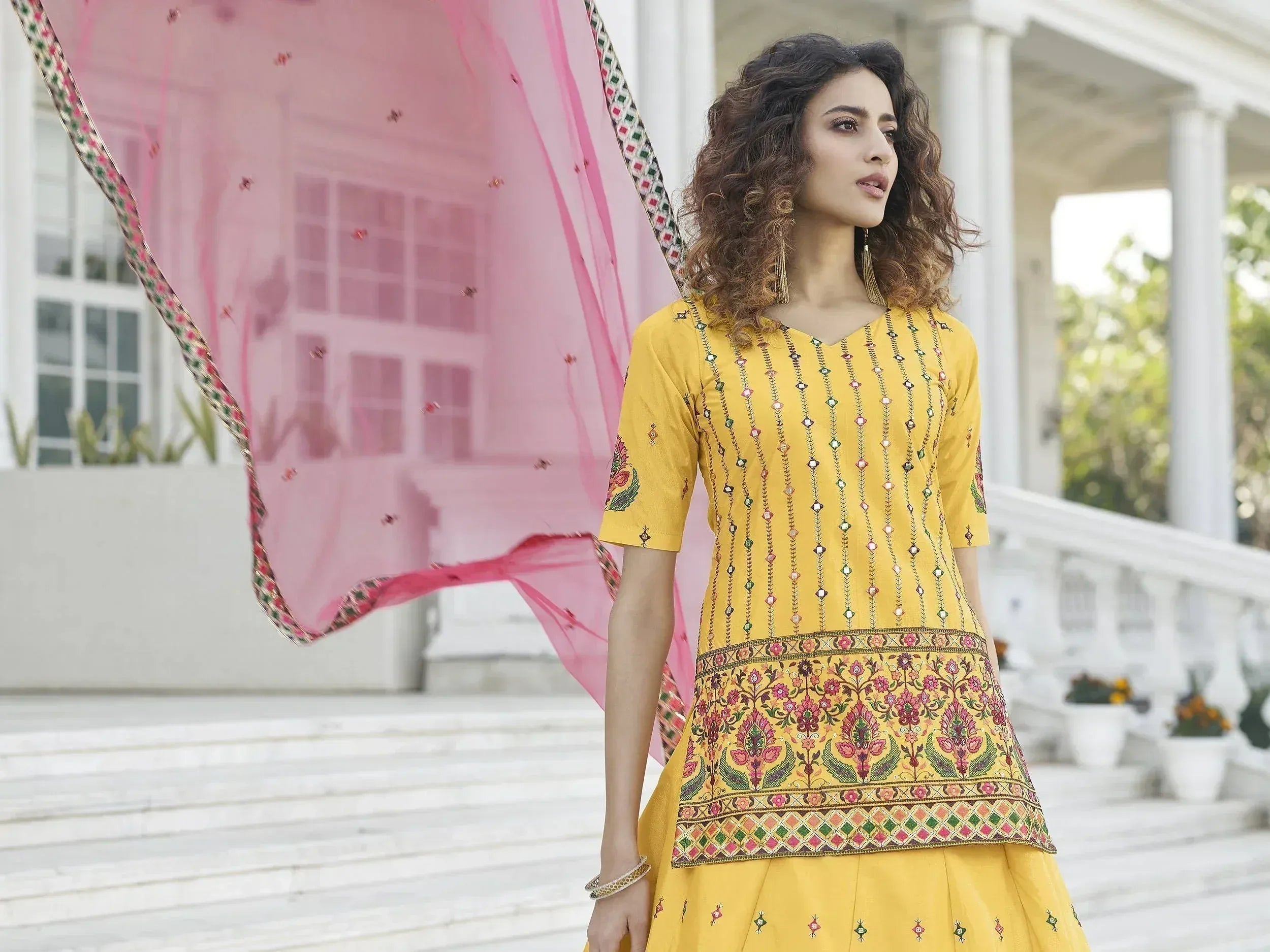 Yellow embroidered ethnic kurta with pink dupatta, perfect for Indian festive occasions and weddings
