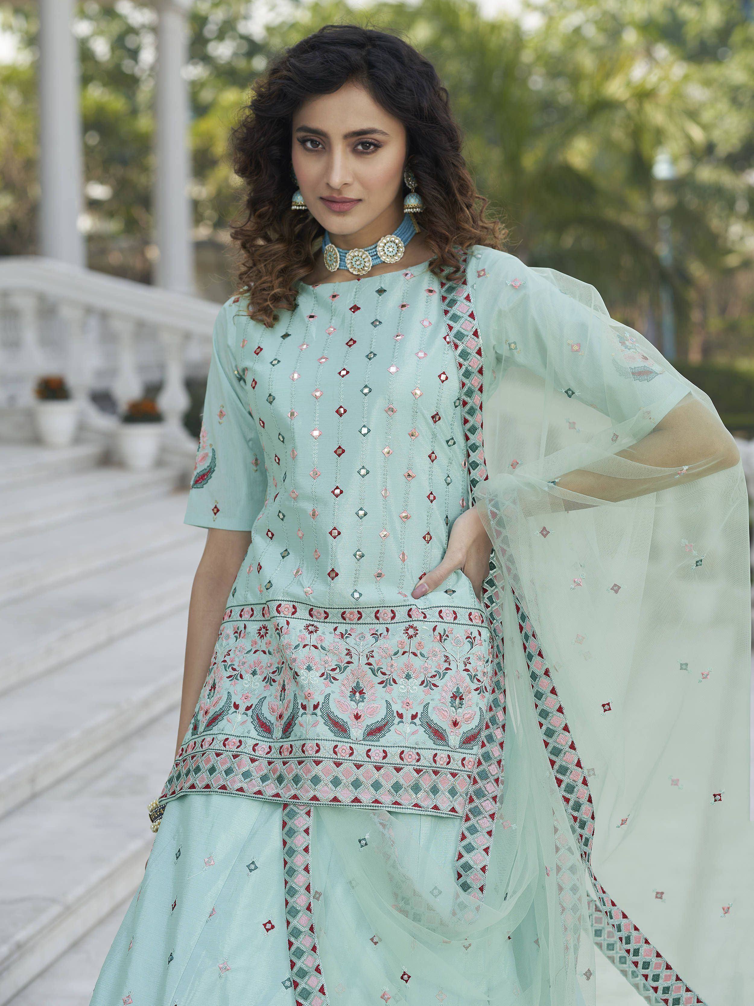 Mint green embroidered salwar kameez with floral mirror work and sheer dupatta, perfect for Indian ethnic wear.