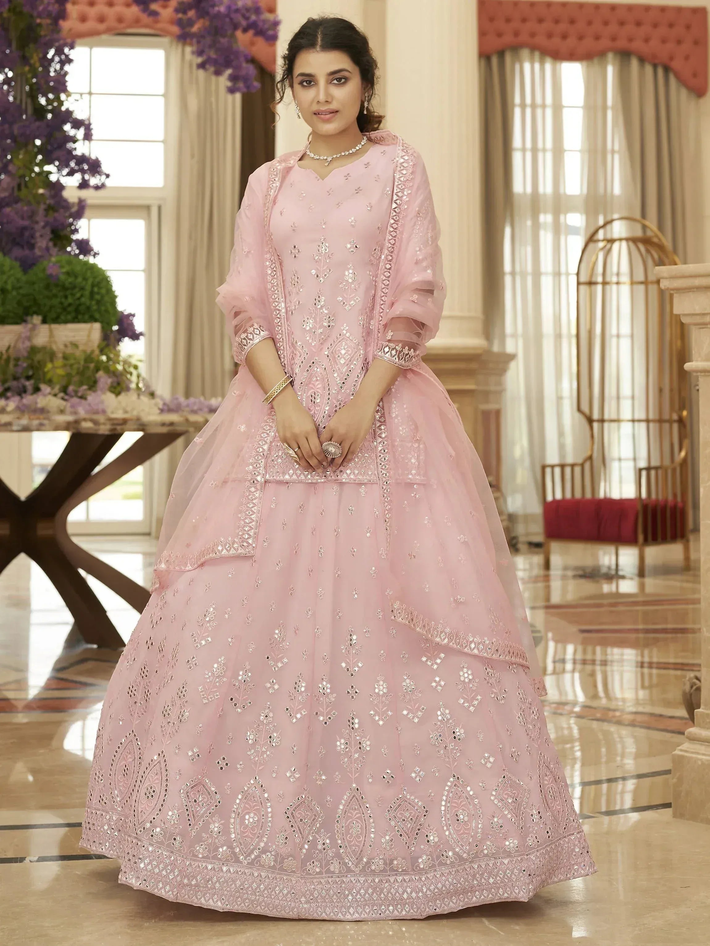 Pink designer lehenga choli with mirror work, perfect for Indian weddings and festive occasions