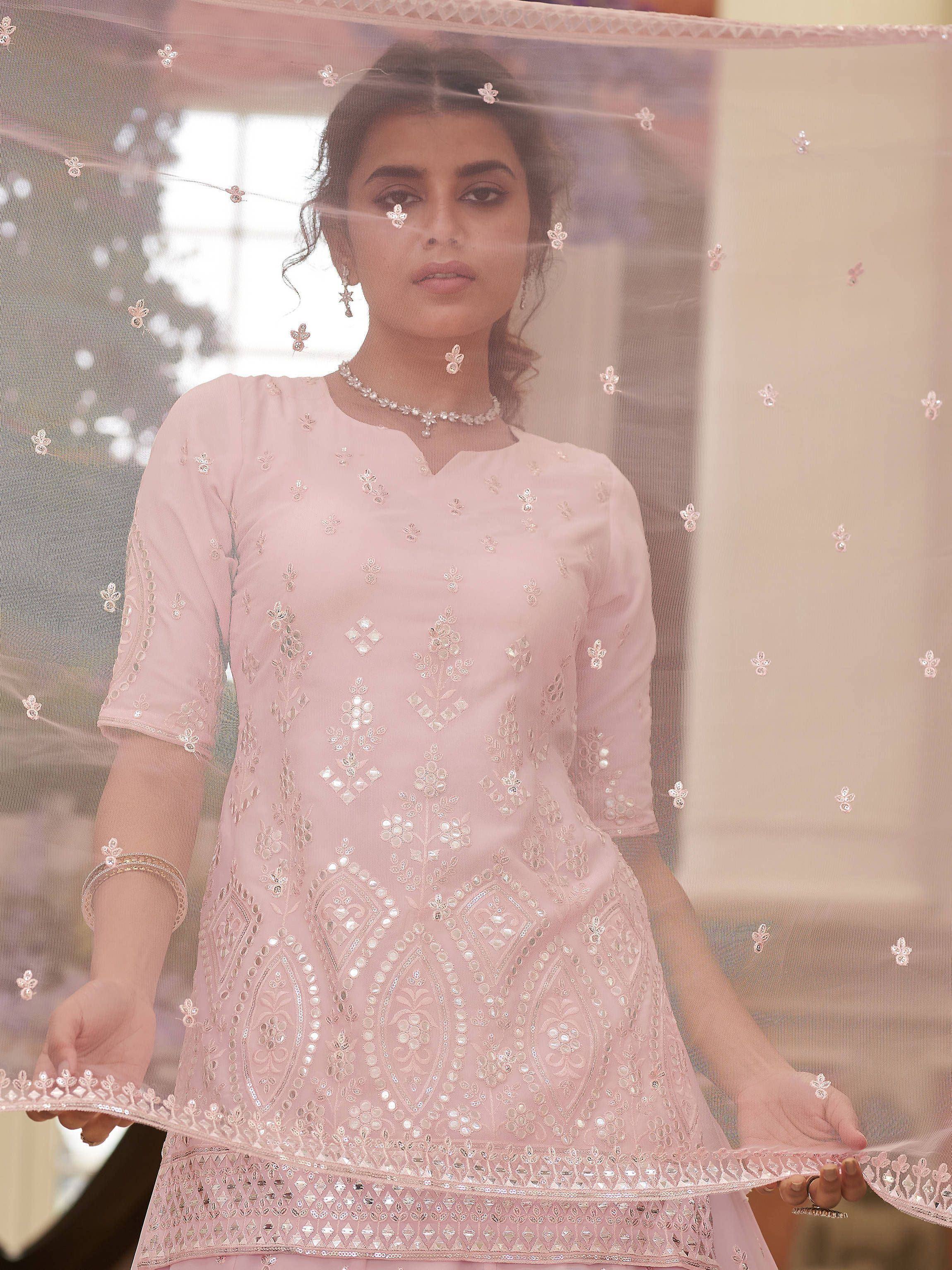 Pink embroidered ethnic gown with matching sheer dupatta, perfect for Indian festive occasions