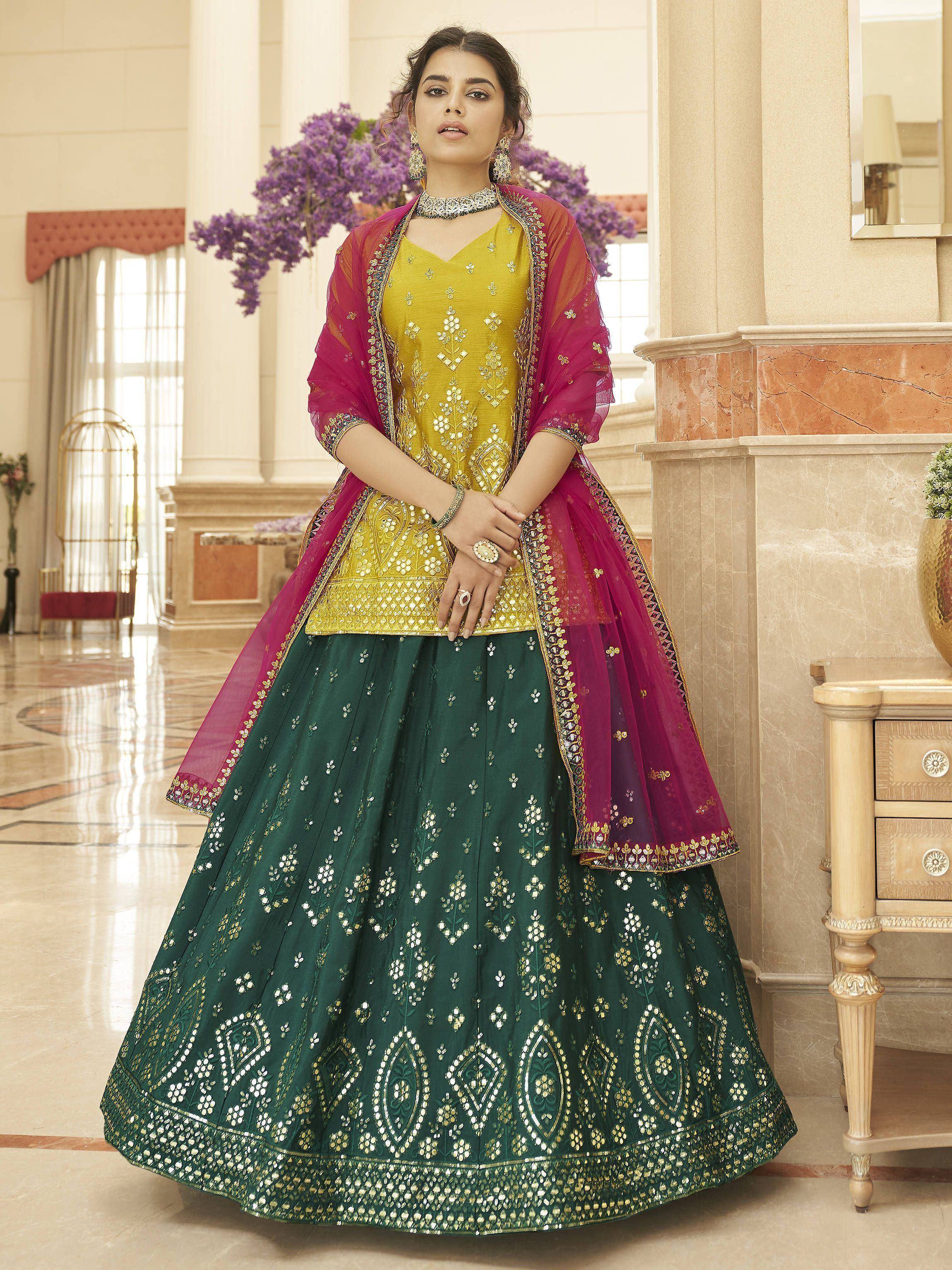 Elegant green and gold embroidered lehenga choli with pink dupatta, perfect for Indian weddings and festive occasions.
