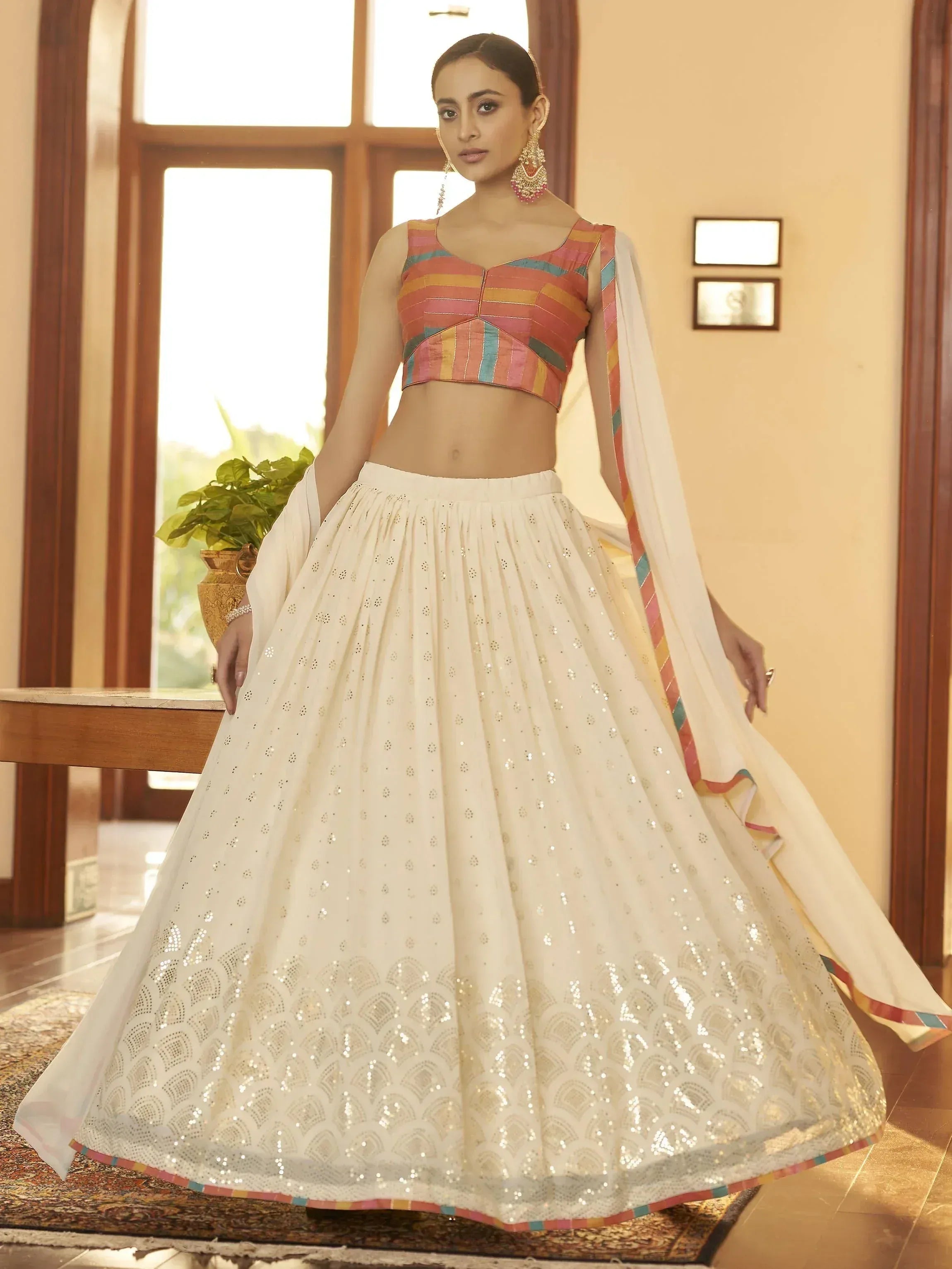 White sequin lehenga with colorful striped blouse, Indian ethnic wear for weddings and parties