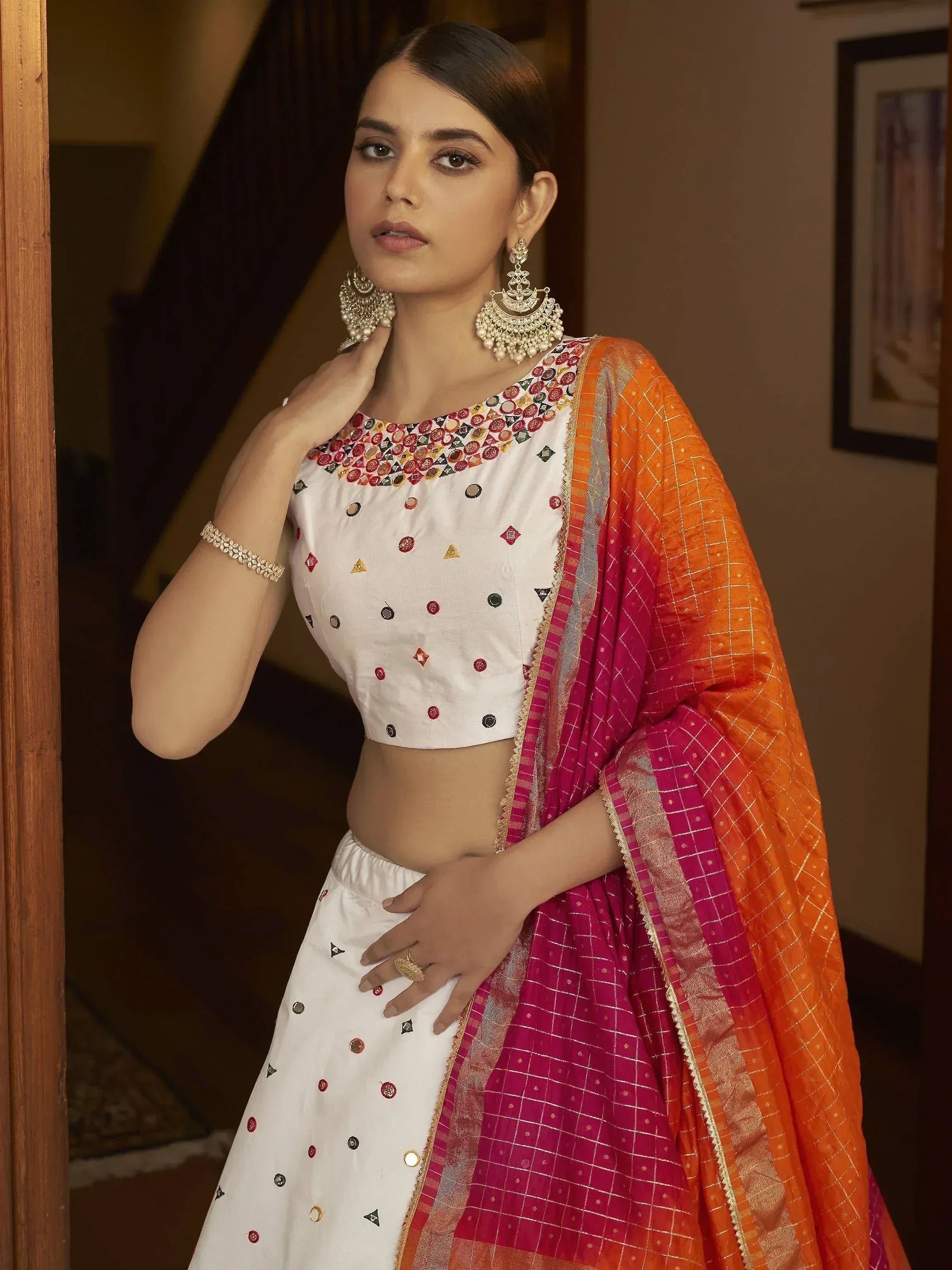 White embroidered lehenga choli with orange pink dupatta, traditional Indian ethnic wear