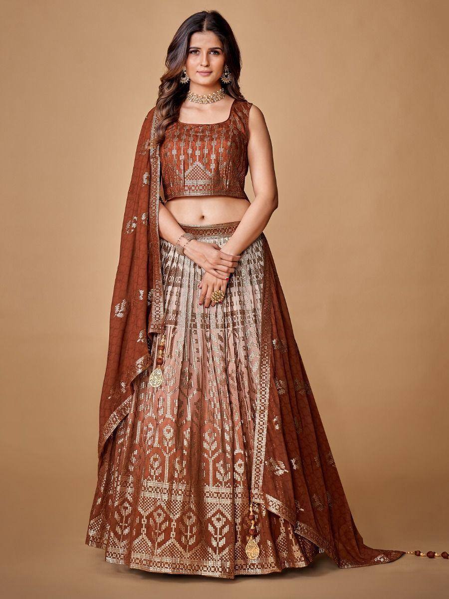 Elegant brown and gold embroidered lehenga choli with matching dupatta, perfect for Indian weddings and festive occasions.