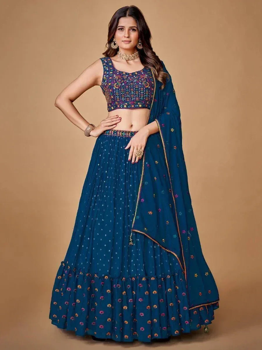 Blue embroidered lehenga choli with floral motifs, perfect for Indian ethnic wear occasions