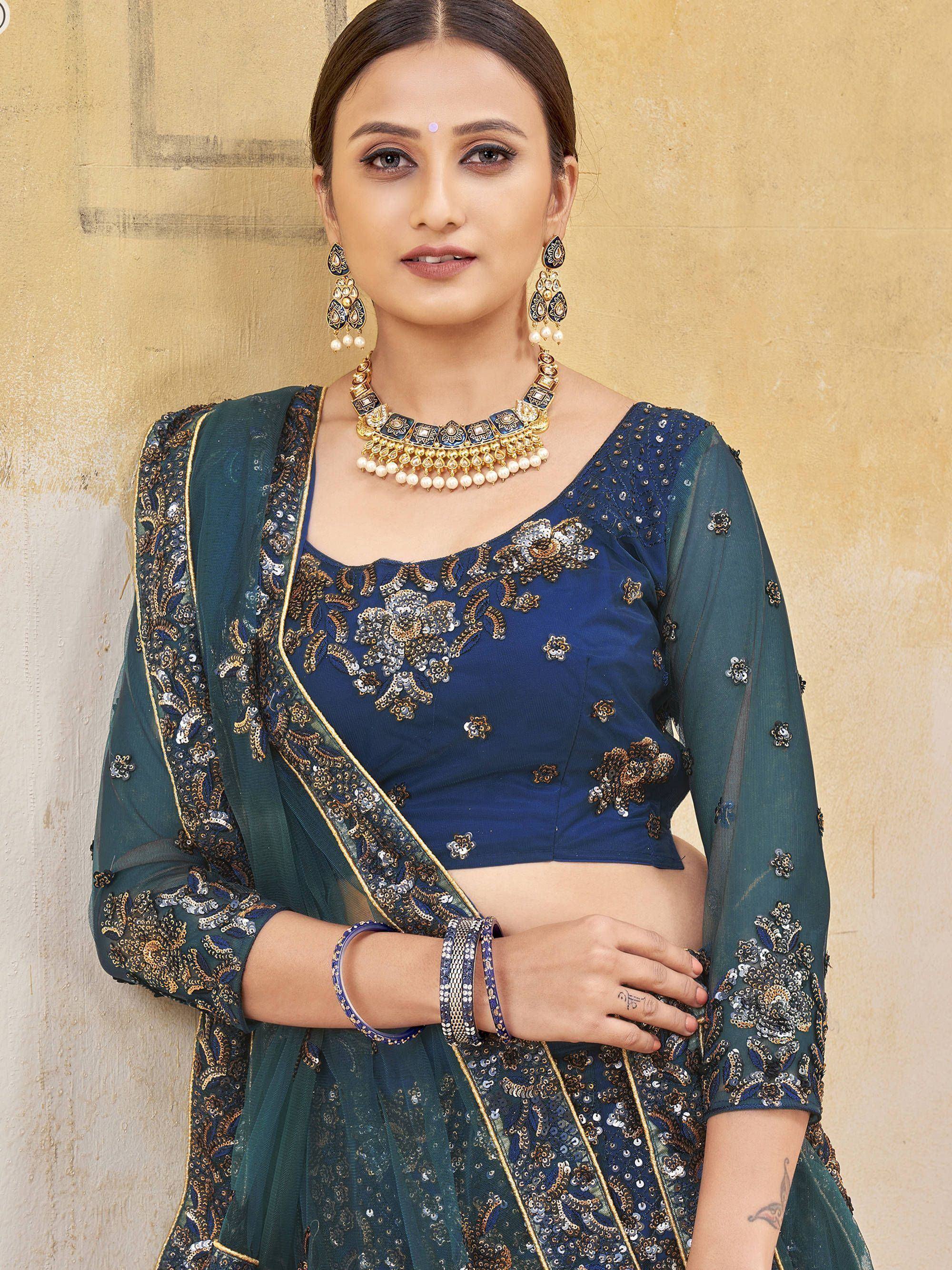 Blue embroidered lehenga choli with green dupatta, perfect for Indian ethnic wear and festive occasions.