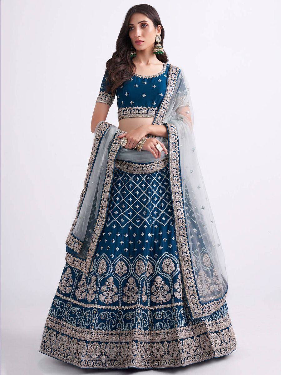 Blue designer lehenga choli with gold embroidery and sheer dupatta, ethnic Indian wear
