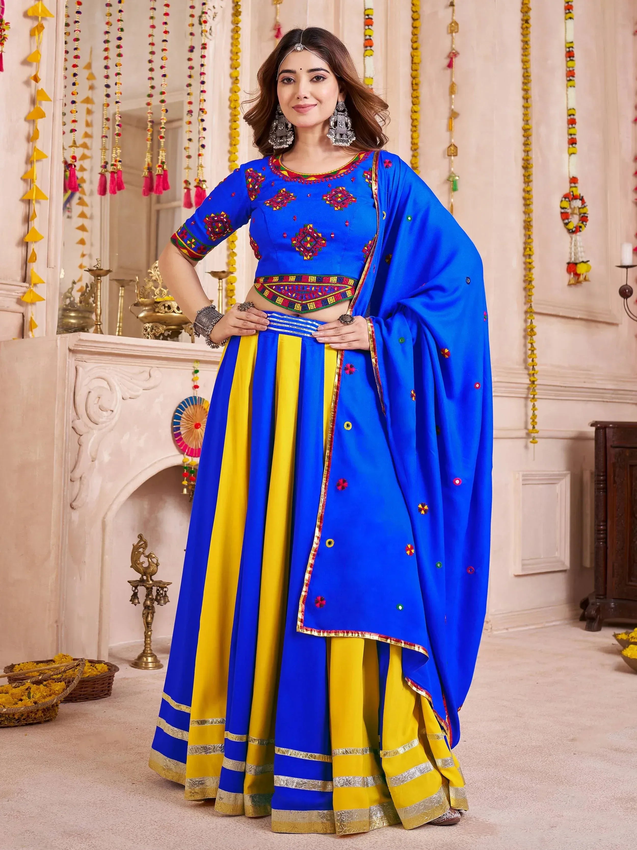 Blue and yellow embroidered lehenga choli with mirror work, perfect for Indian ethnic wear occasions