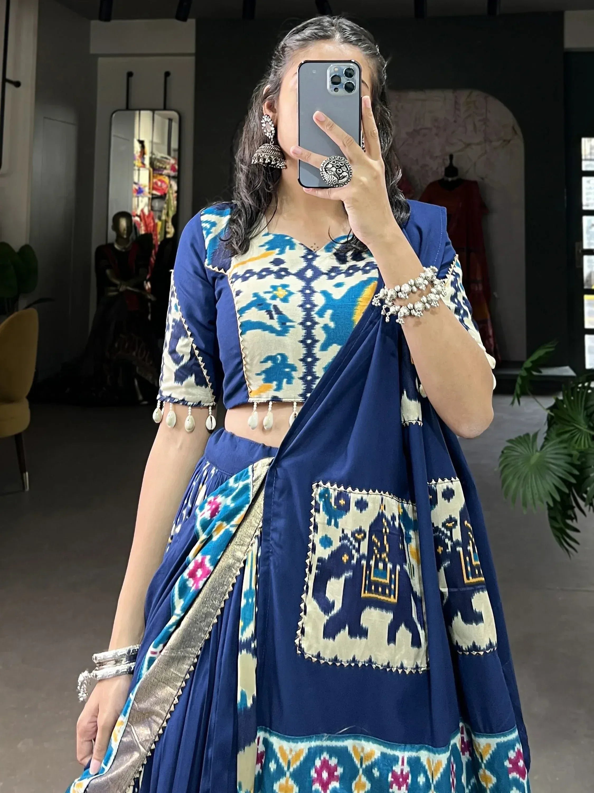 Blue ikat print lehenga choli with elephant motifs, traditional Indian ethnic wear for women