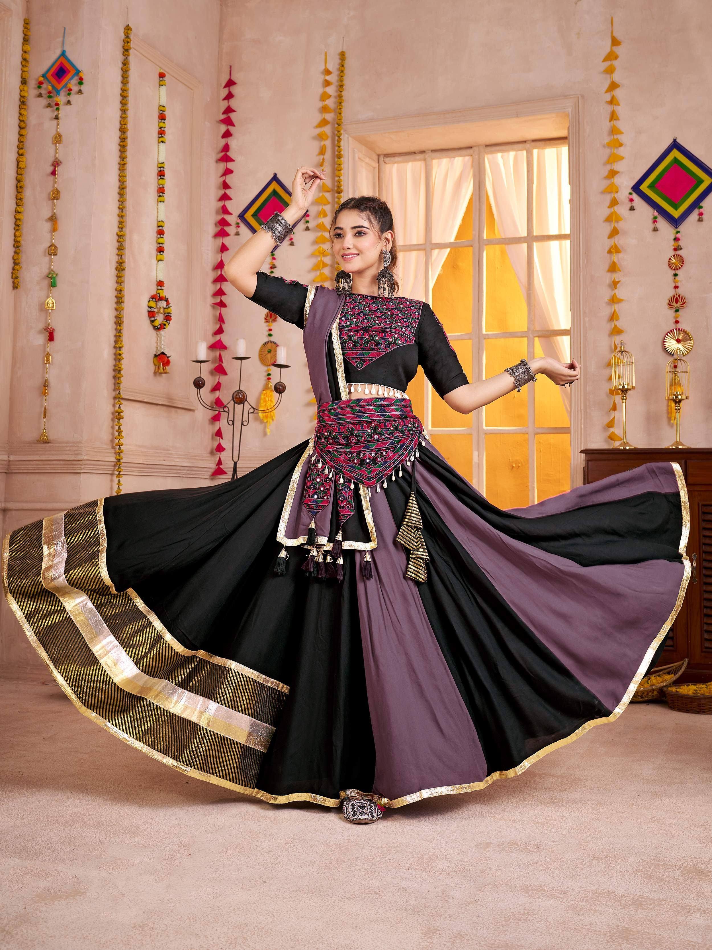 Elegant black and purple ethnic gown with gold trim and intricate embroidery for festive occasions