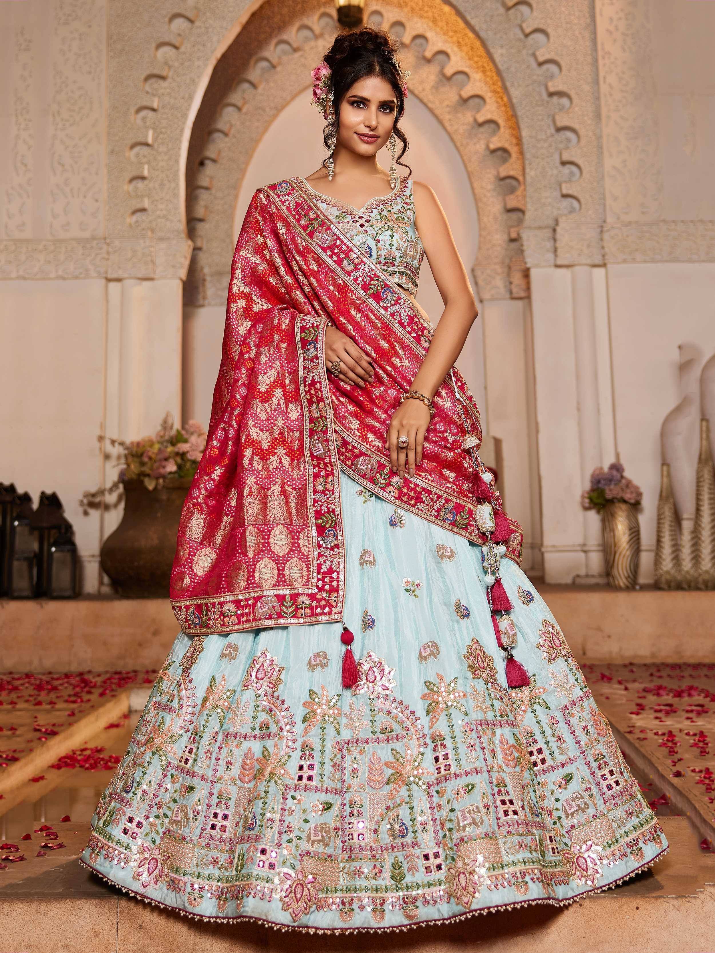 Light blue embroidered lehenga choli with pink dupatta, perfect for Indian weddings and festive occasions