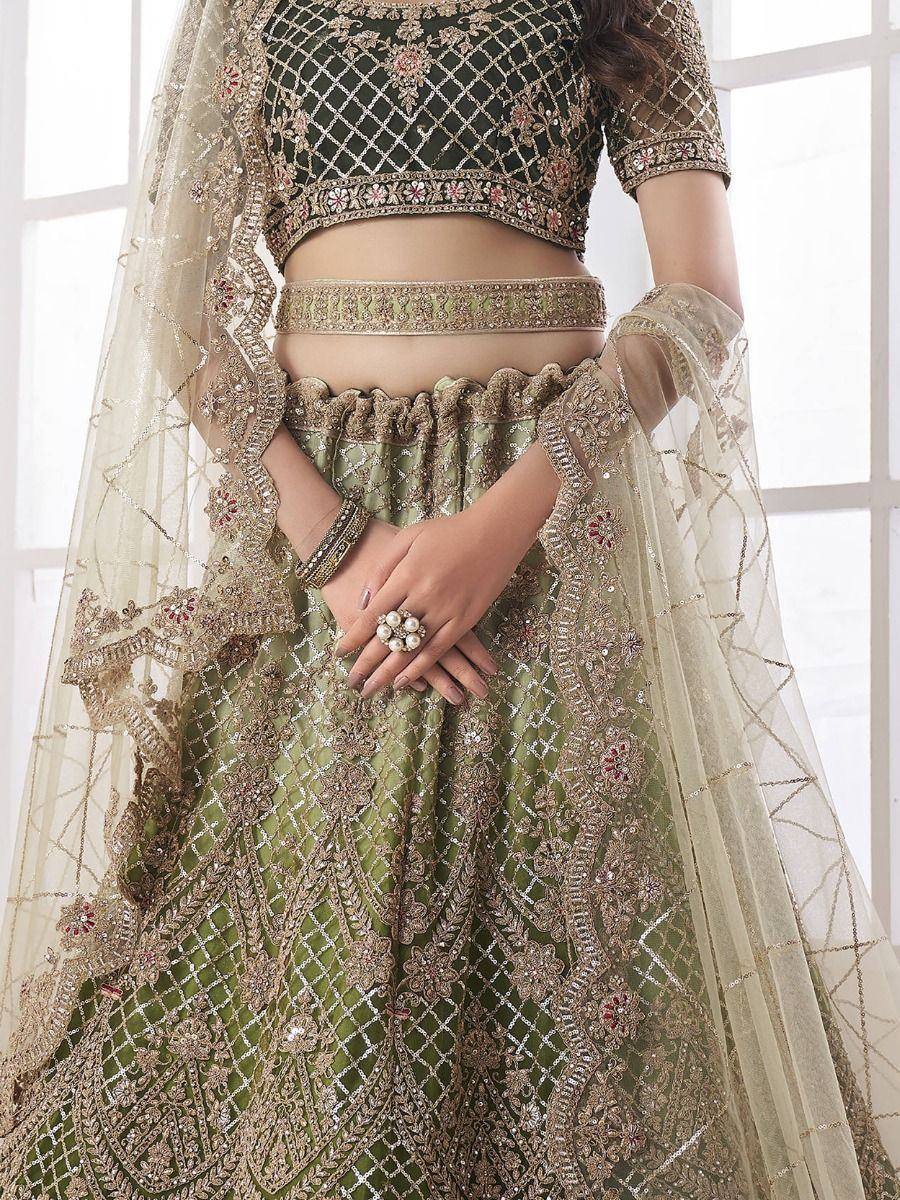 Emerald green designer lehenga choli with heavy gold embroidery and sheer dupatta for weddings