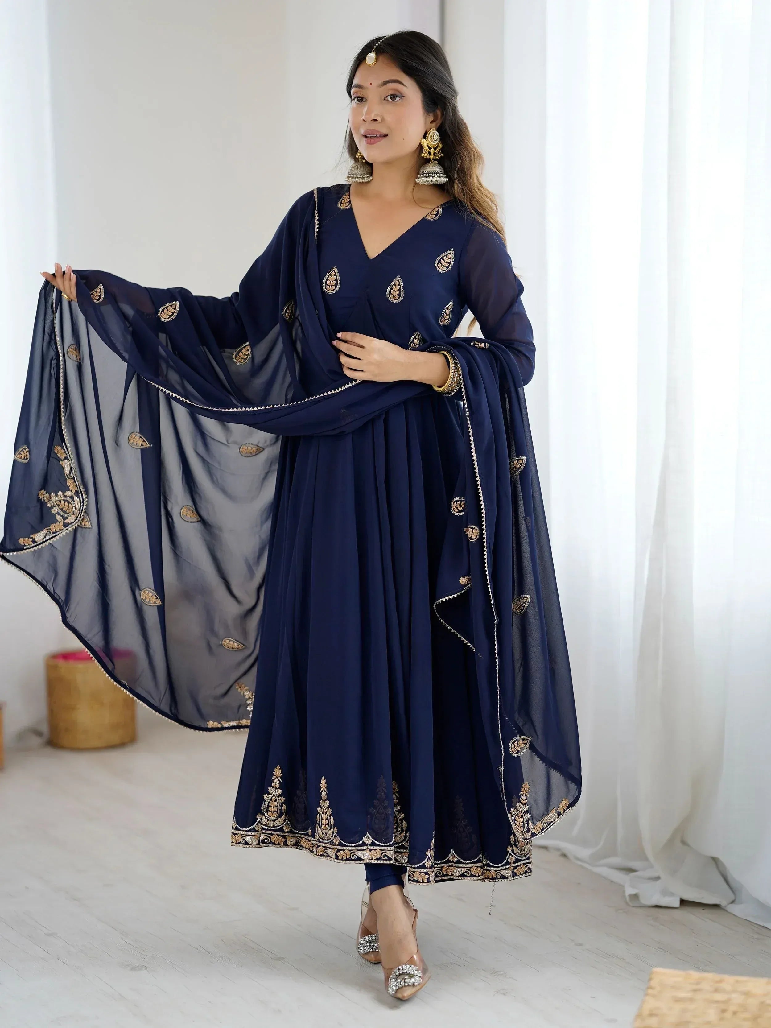 Navy blue embroidered anarkali suit with gold detailing and matching dupatta, perfect for Indian ethnic occasions.