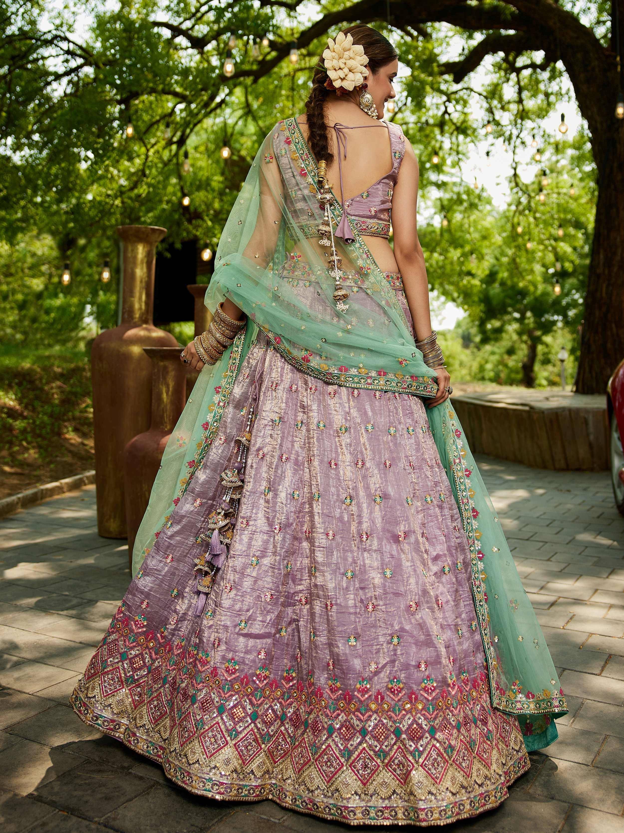 Lavender embroidered lehenga choli with mint dupatta, perfect for Indian weddings and festive occasions.