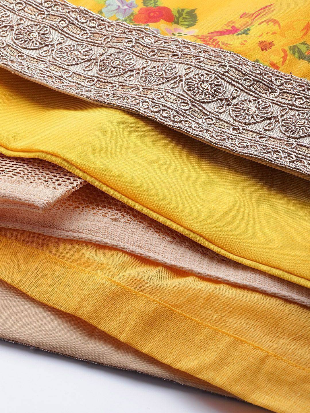Yellow floral lehenga with embroidered border and layered fabric details