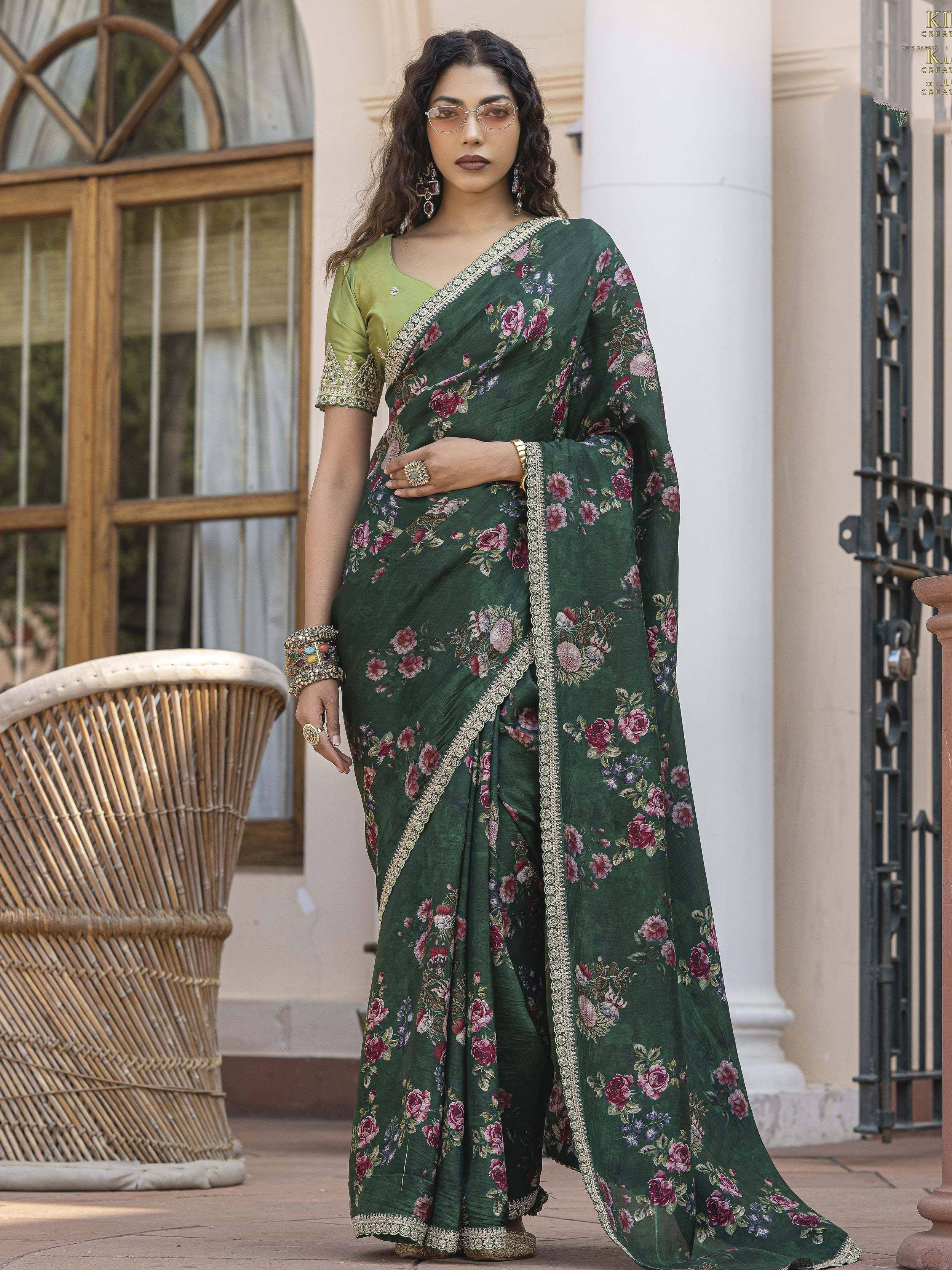 Green floral printed saree with gold border, paired with matching blouse, perfect for ethnic occasions.