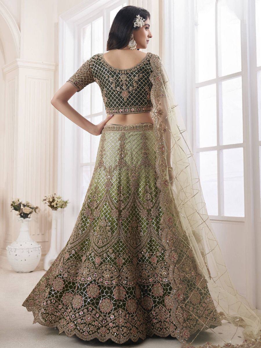 Elegant green embroidered lehenga choli with gold detailing, perfect for Indian weddings and festive occasions.