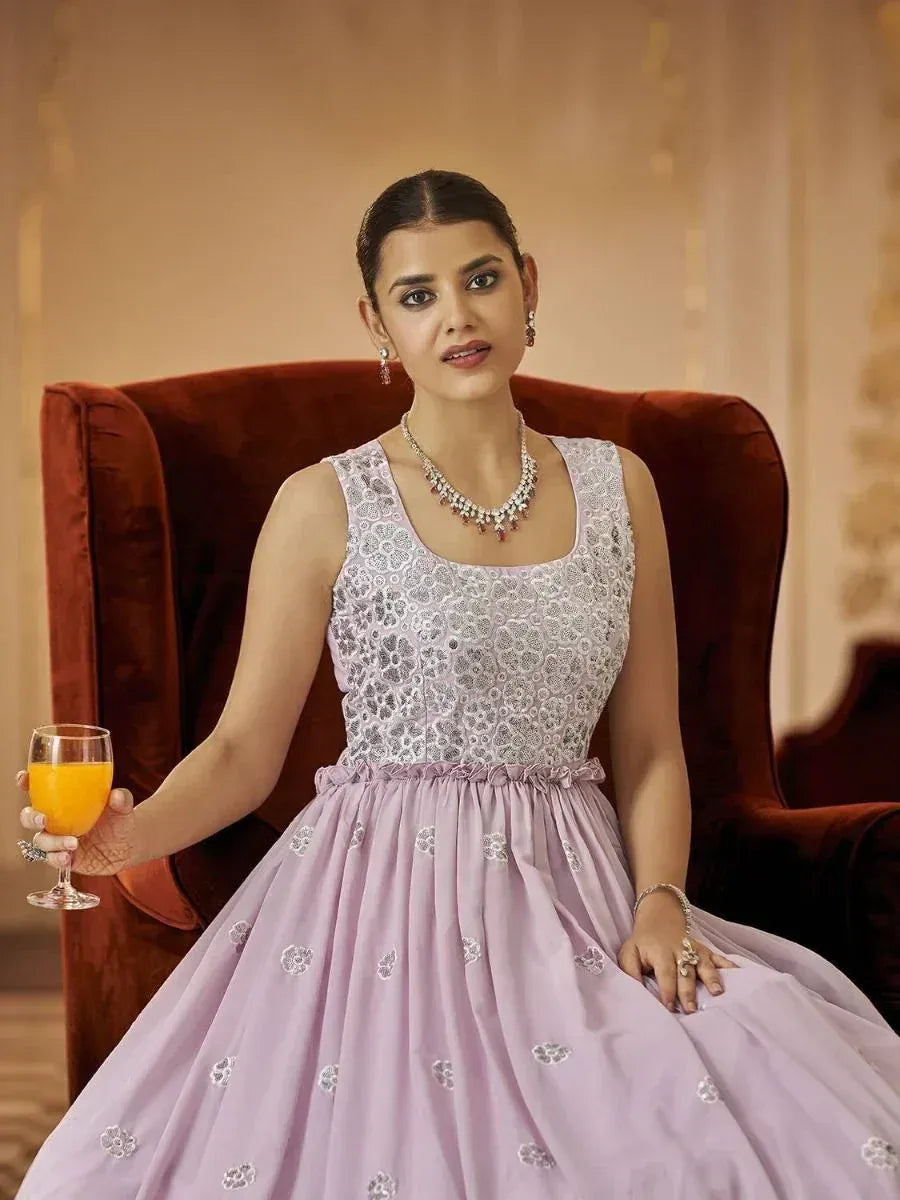 Elegant lavender ethnic gown with floral embroidery, perfect for Indian celebrations and events.