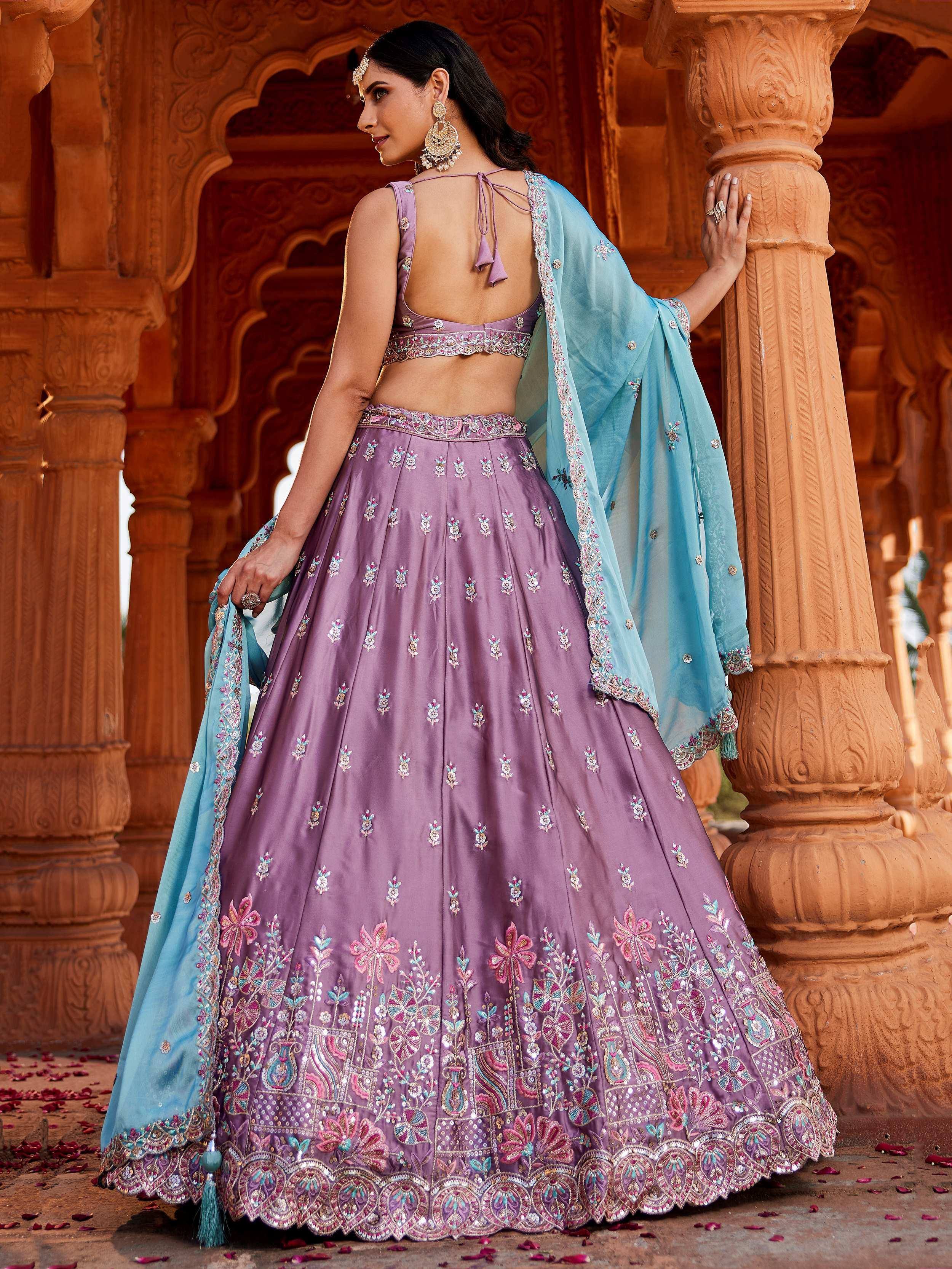 Purple embroidered lehenga choli with blue dupatta, perfect for Indian ethnic wear occasions.