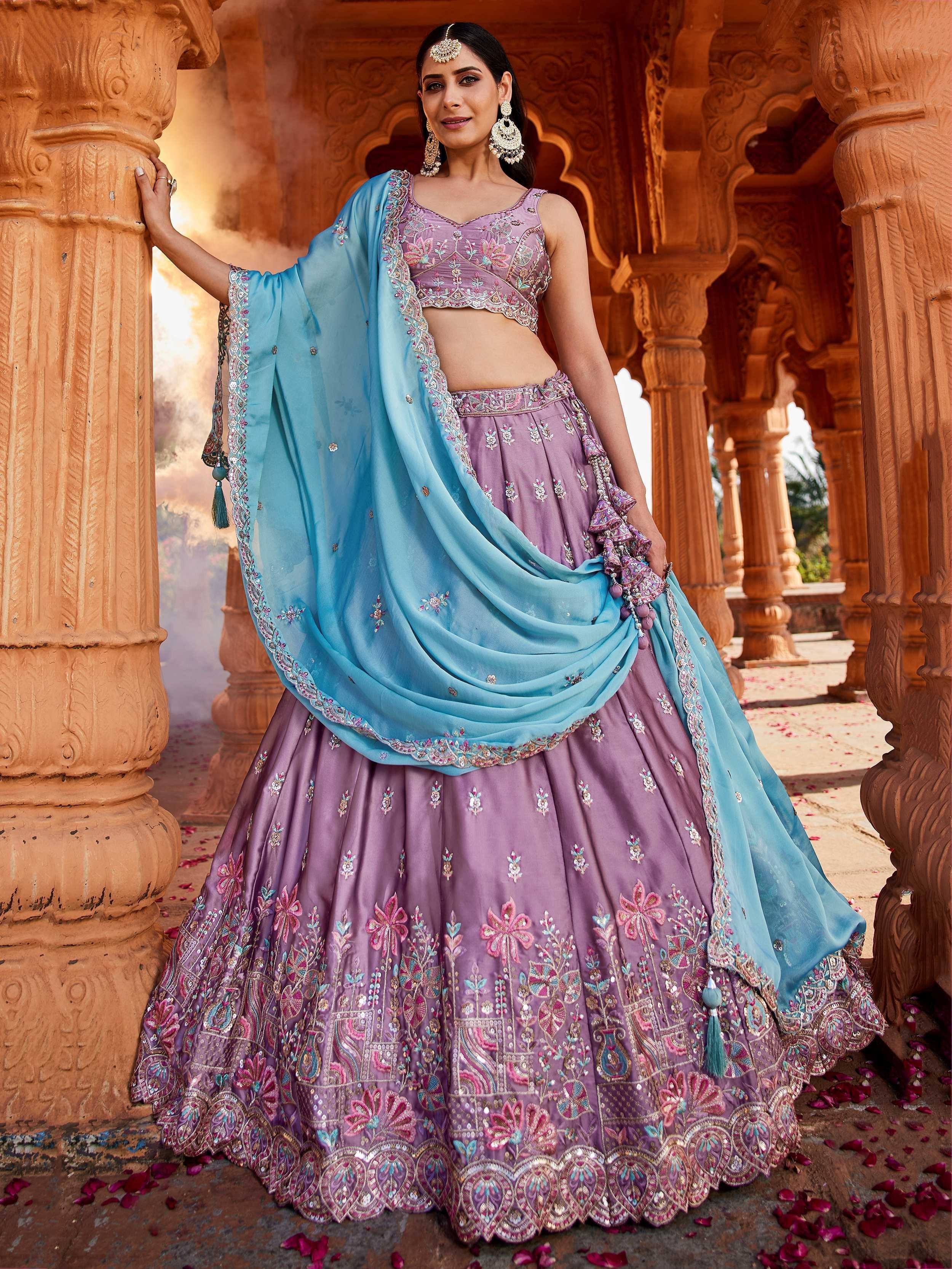 Purple embroidered lehenga choli with blue dupatta, perfect for Indian ethnic wear and festive occasions.