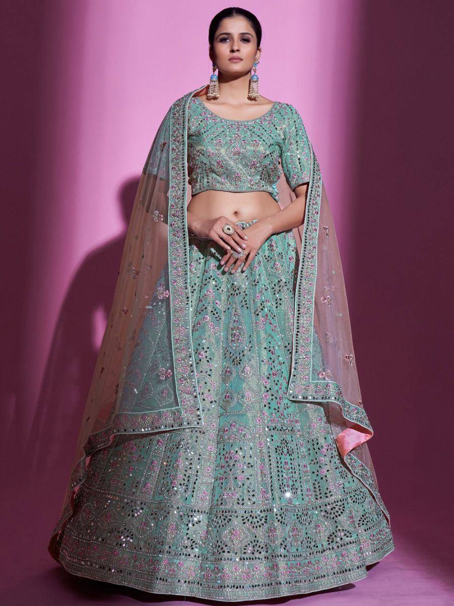 Mint green embroidered lehenga choli with floral mirror work and sheer dupatta, perfect for Indian weddings