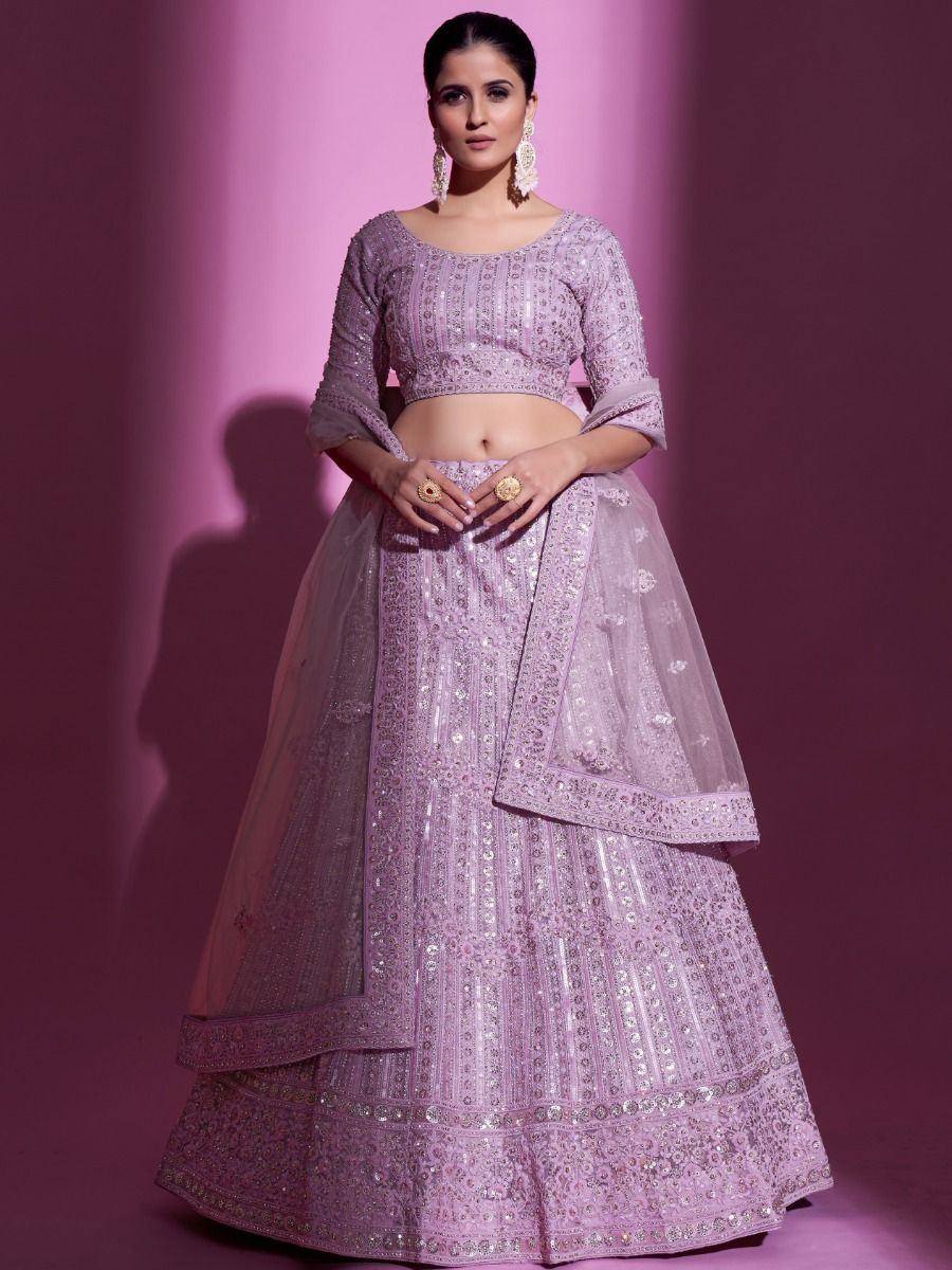 Lavender designer lehenga choli with intricate embroidery and sequins, perfect for Indian weddings and festive occasions.