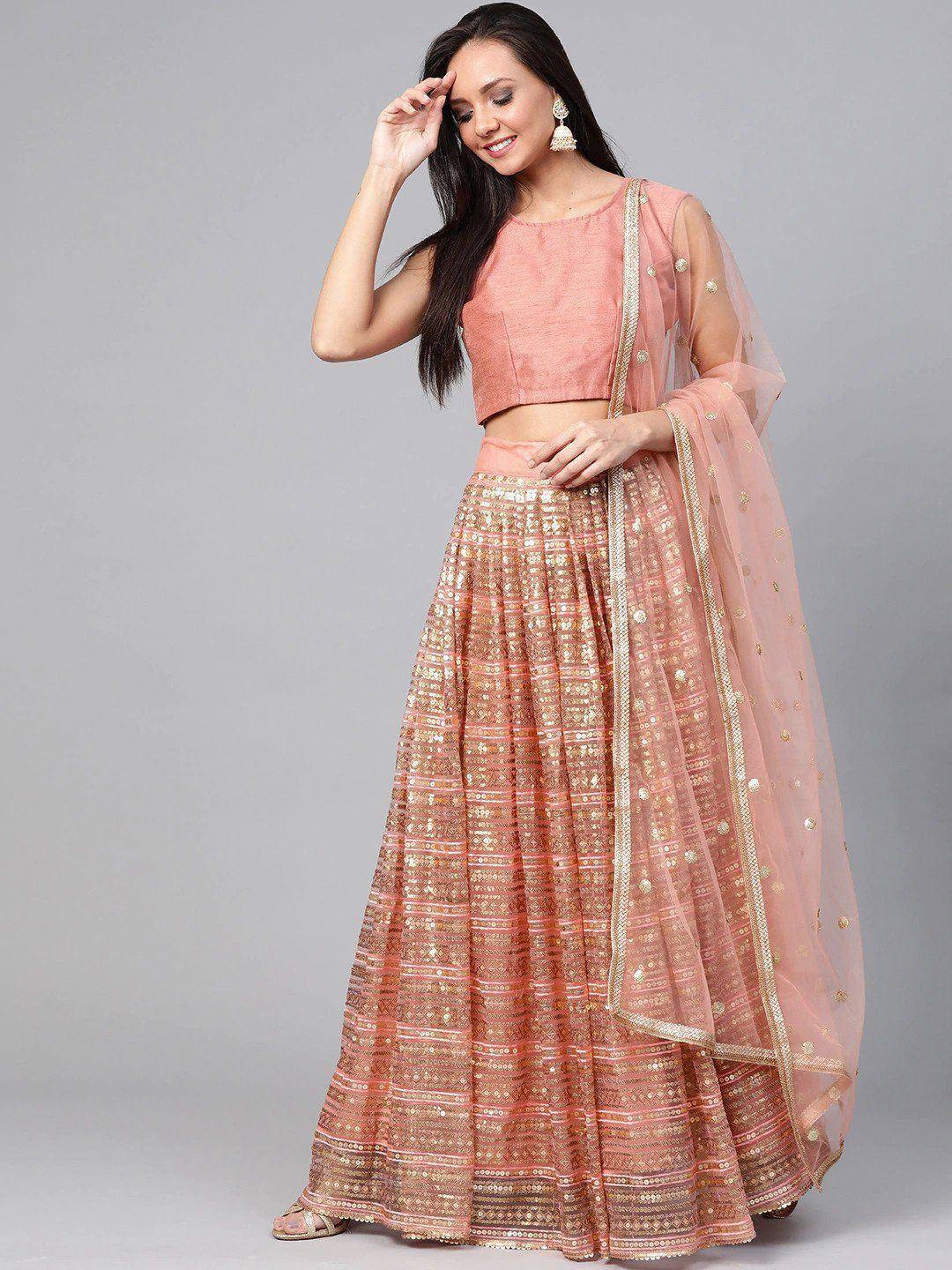 Pink designer lehenga choli with gold embroidery and sheer dupatta for Indian ethnic wear