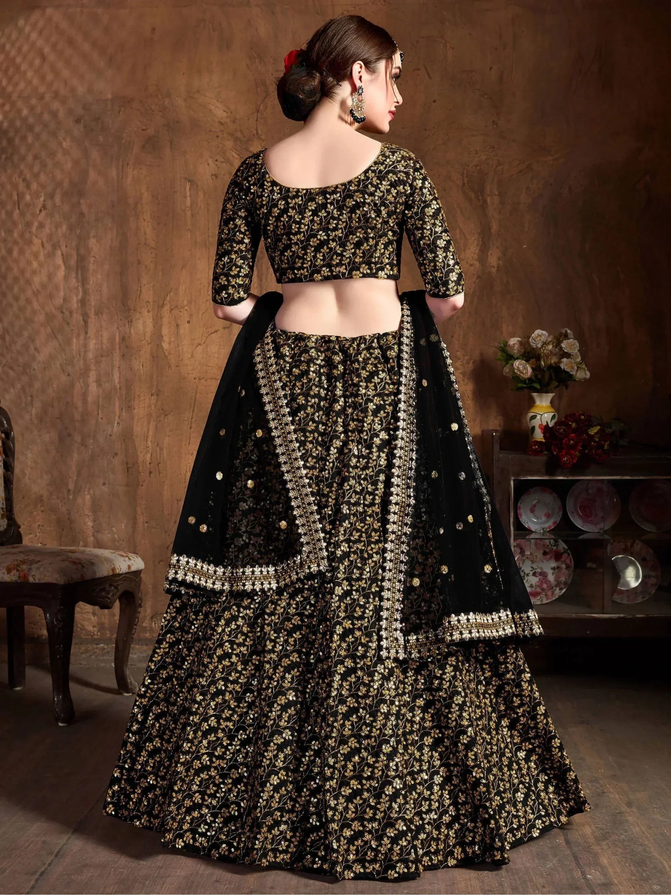 Black and gold embroidered lehenga choli with floral sequin work, perfect for Indian ethnic occasions