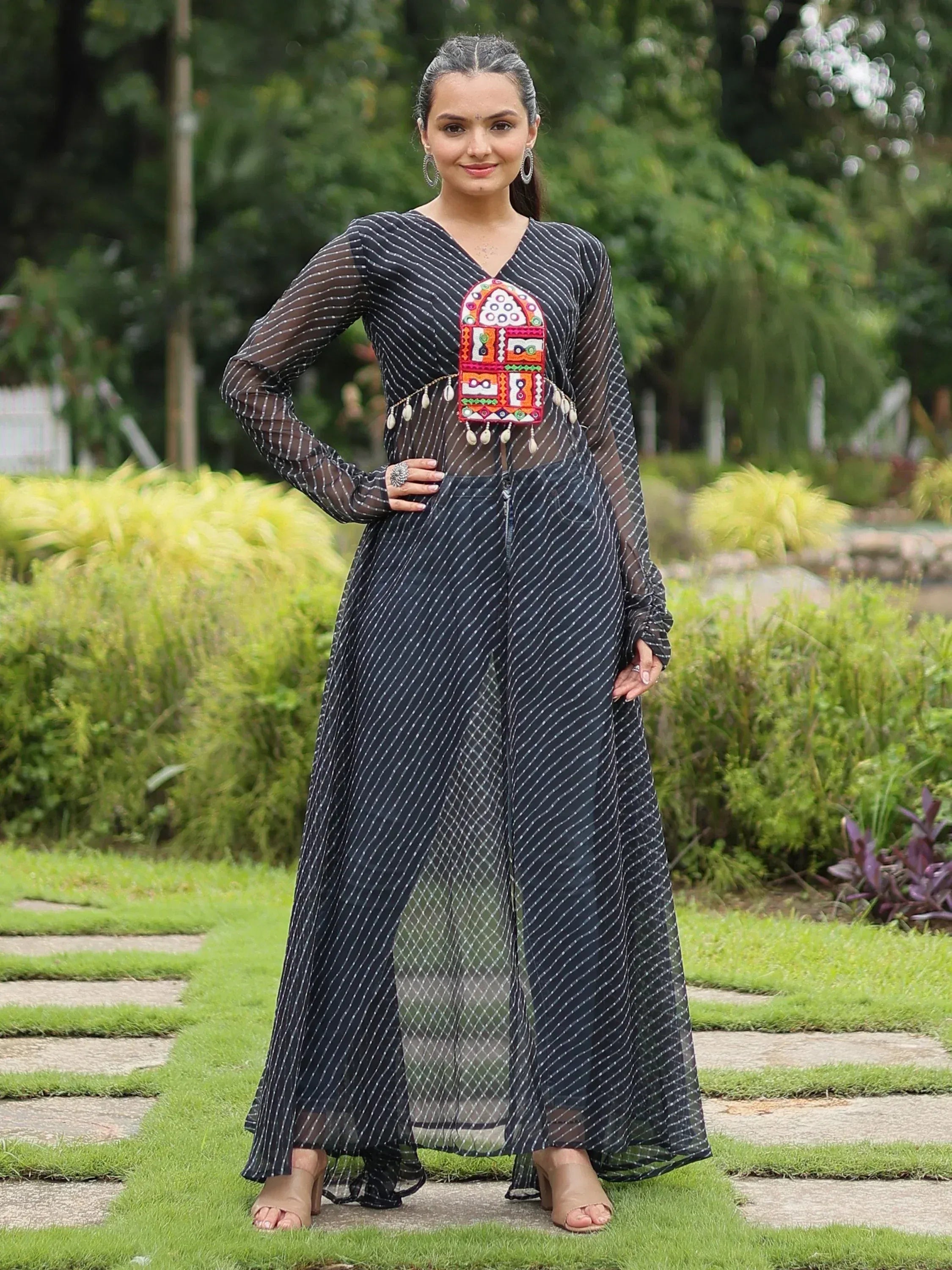 Black striped ethnic gown with colorful embroidered panel, perfect for Indian festive occasions