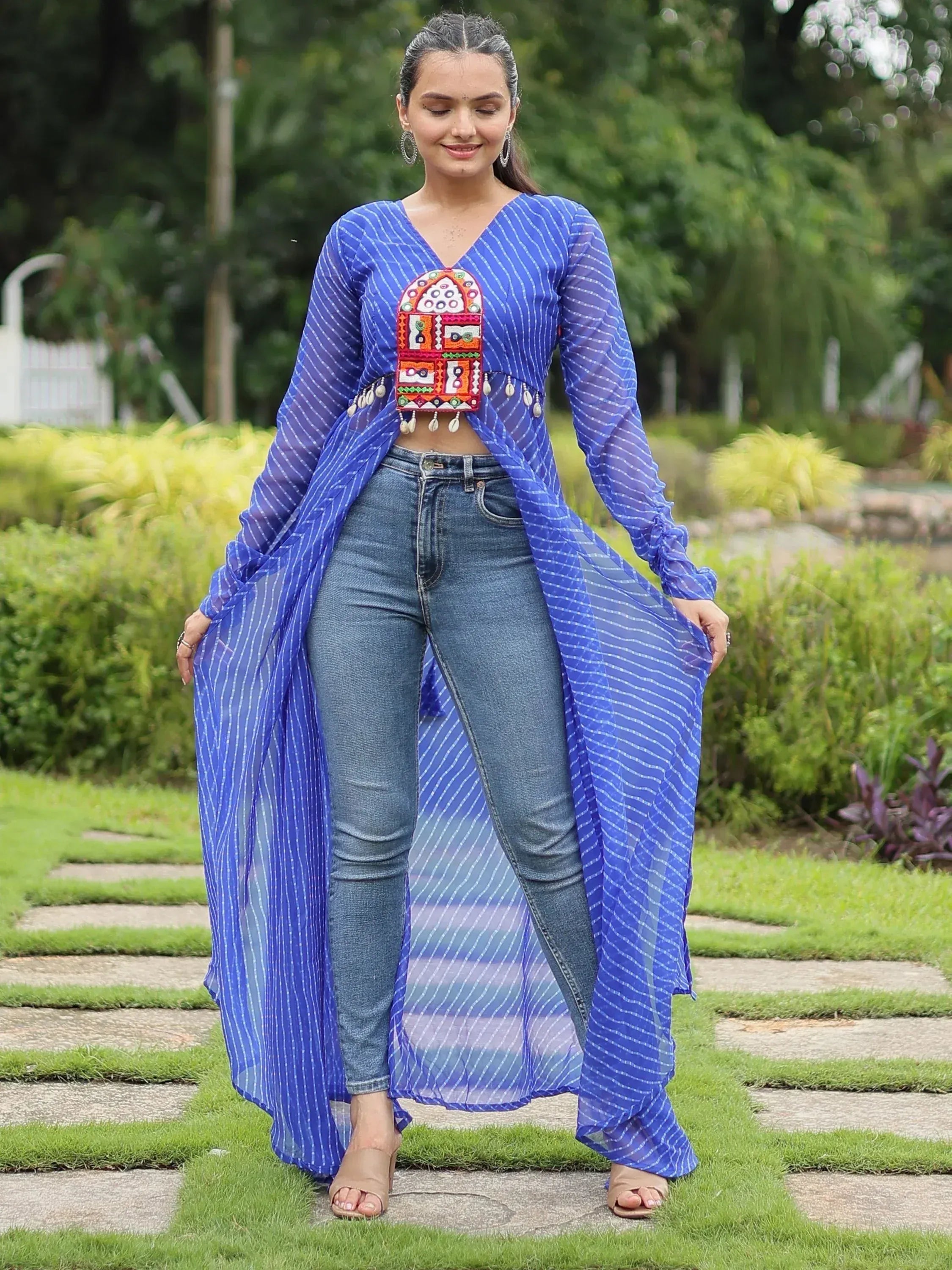 Blue striped ethnic long jacket with mirror work, paired with jeans for casual wear
