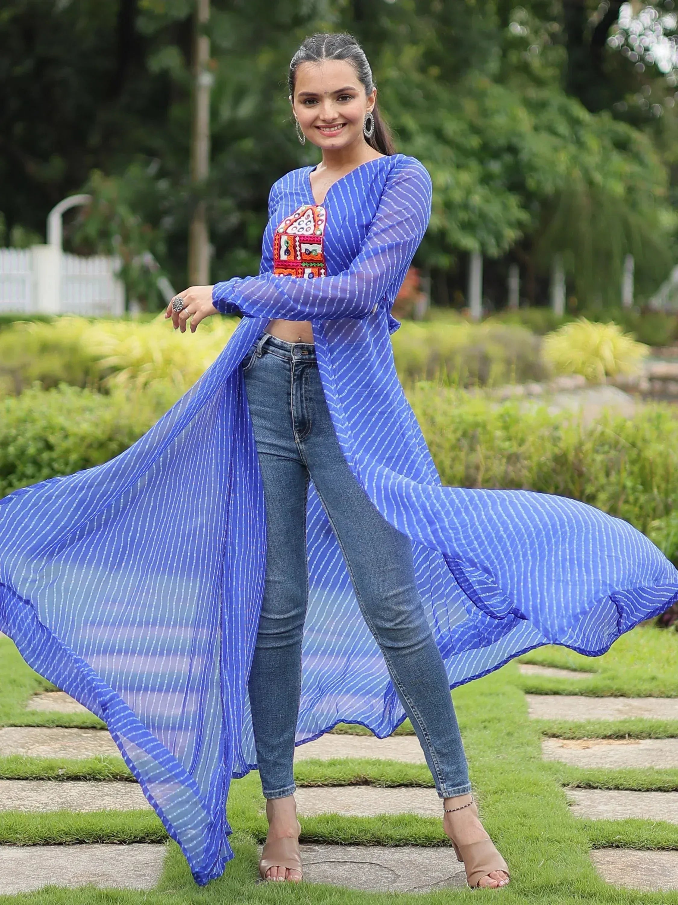 Blue striped ethnic long kurta with embroidery, paired with jeans for a fusion look