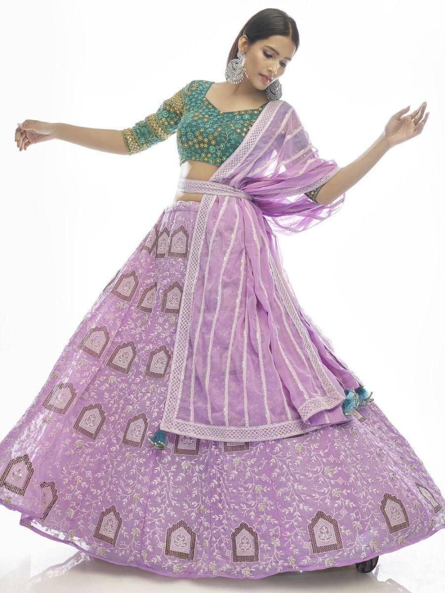 Purple embroidered lehenga choli with green blouse, perfect for Indian ethnic occasions