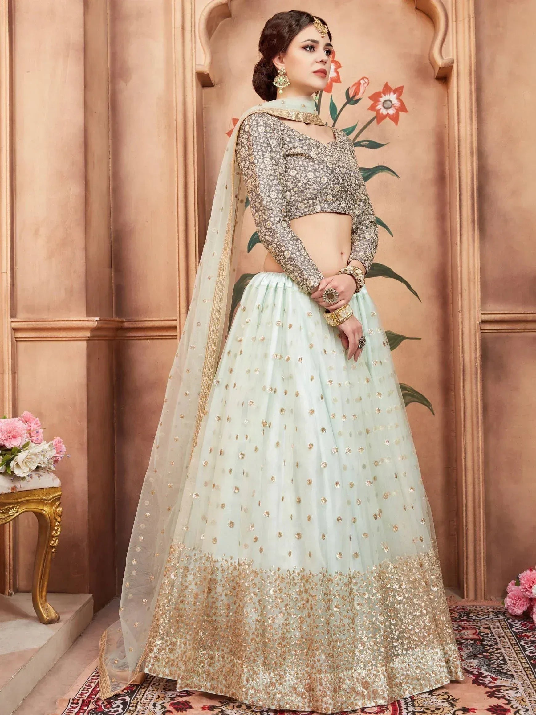 Mint green and gold embroidered lehenga choli with sheer dupatta, perfect for Indian weddings and festive occasions