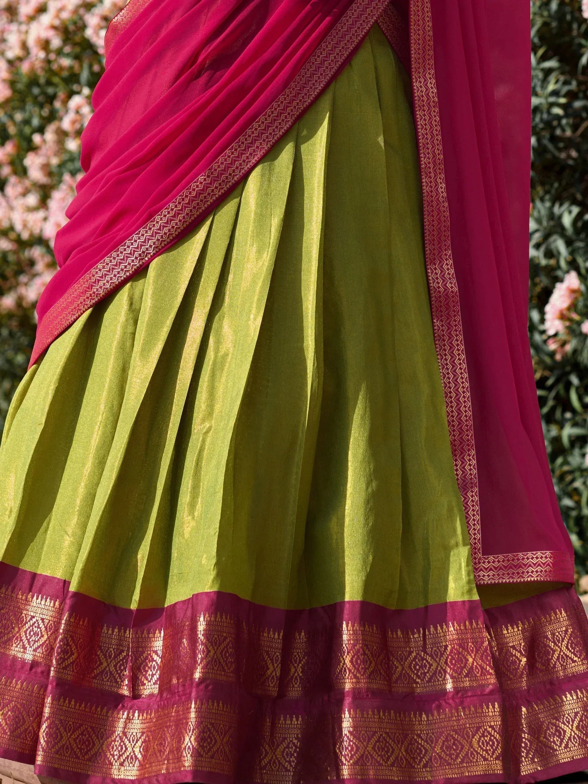 Green and pink ethnic saree with golden border, perfect for Indian occasions