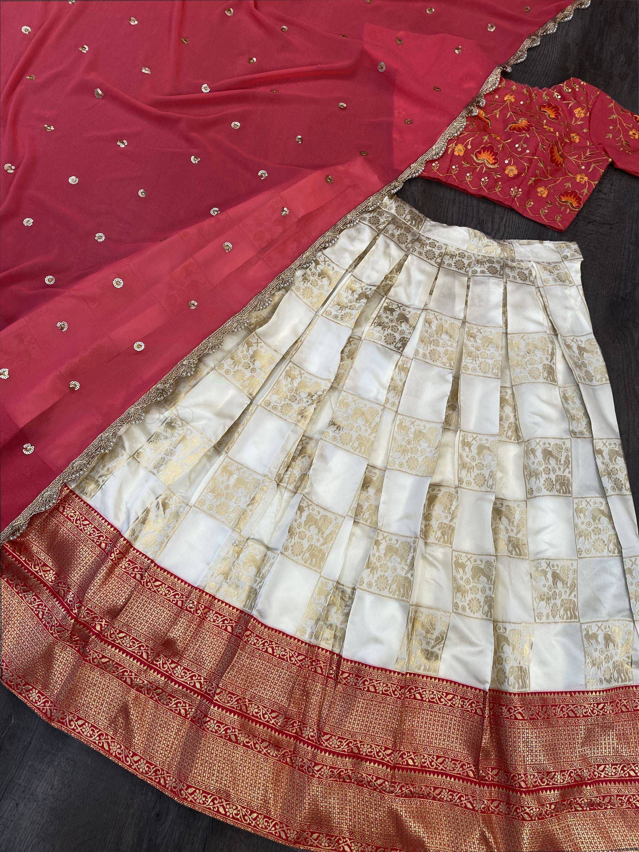 Elegant red and white lehenga choli with gold elephant print skirt, floral blouse, and embellished dupatta for Indian ethnic wear