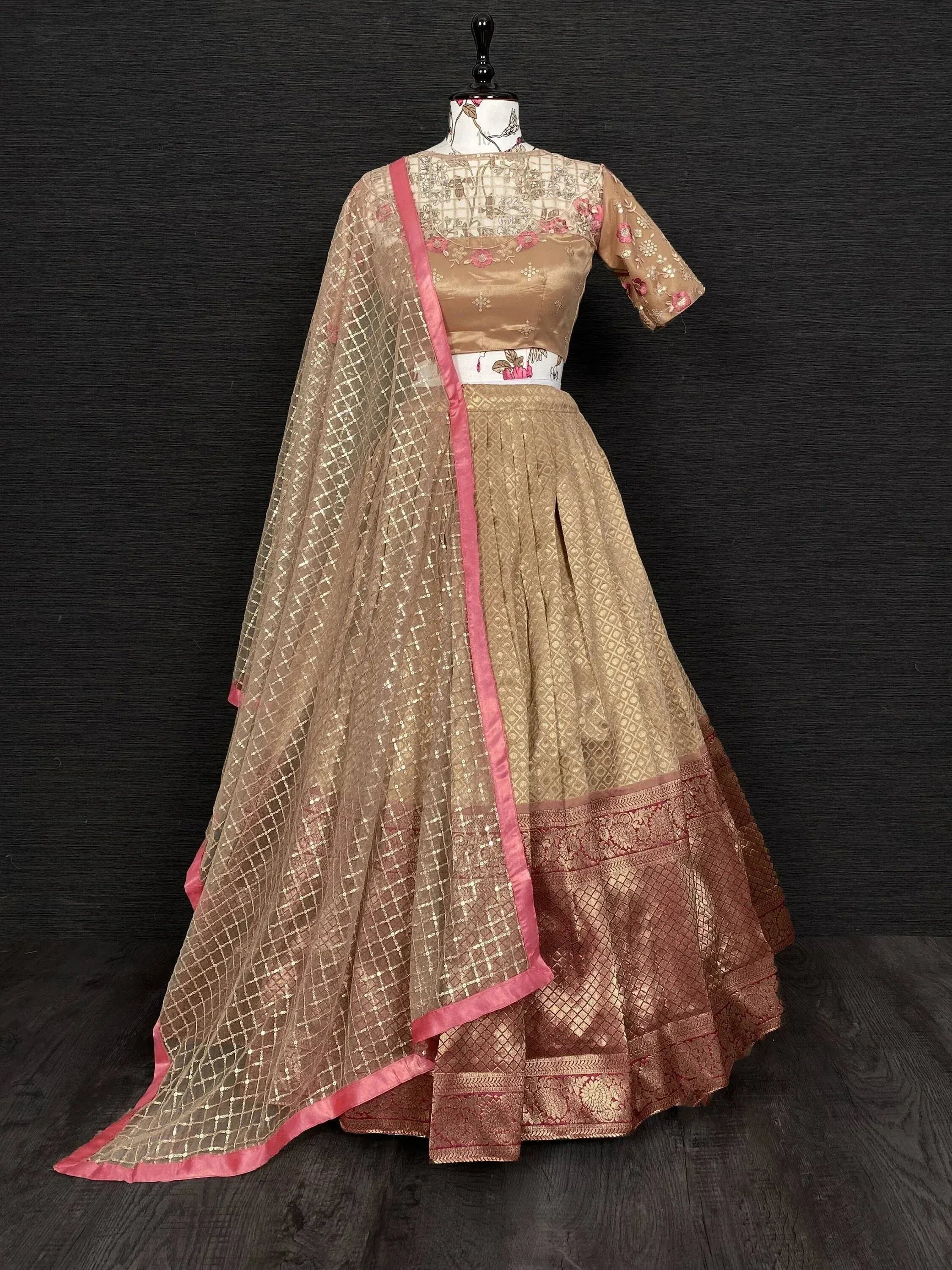 Golden embroidered lehenga choli with pink border and net dupatta, Indian ethnic wear