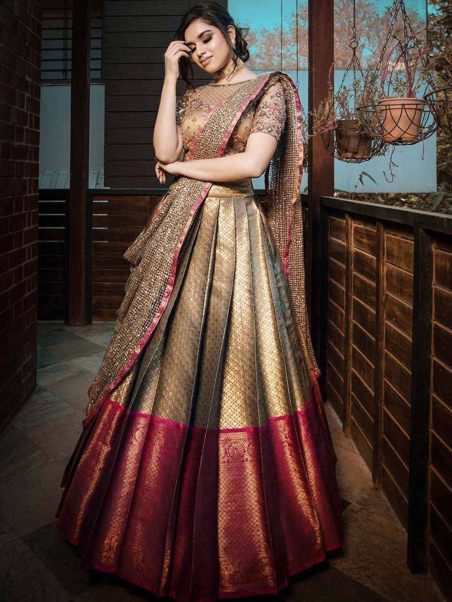 Elegant gold and maroon lehenga choli with intricate embroidery, perfect for Indian ethnic wear occasions.