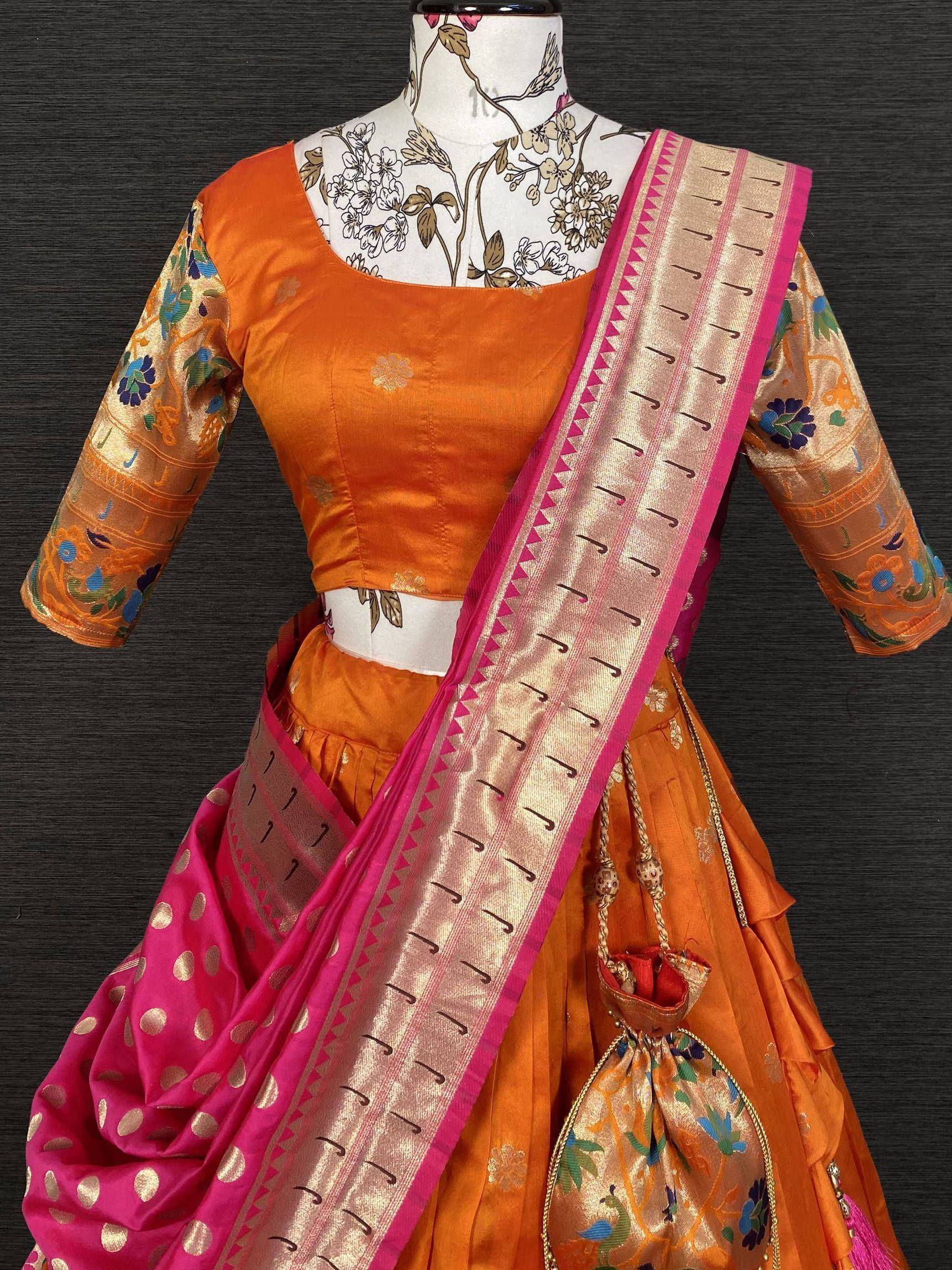 Orange designer lehenga choli with pink dupatta, floral embroidery, and gold accents for ethnic wear