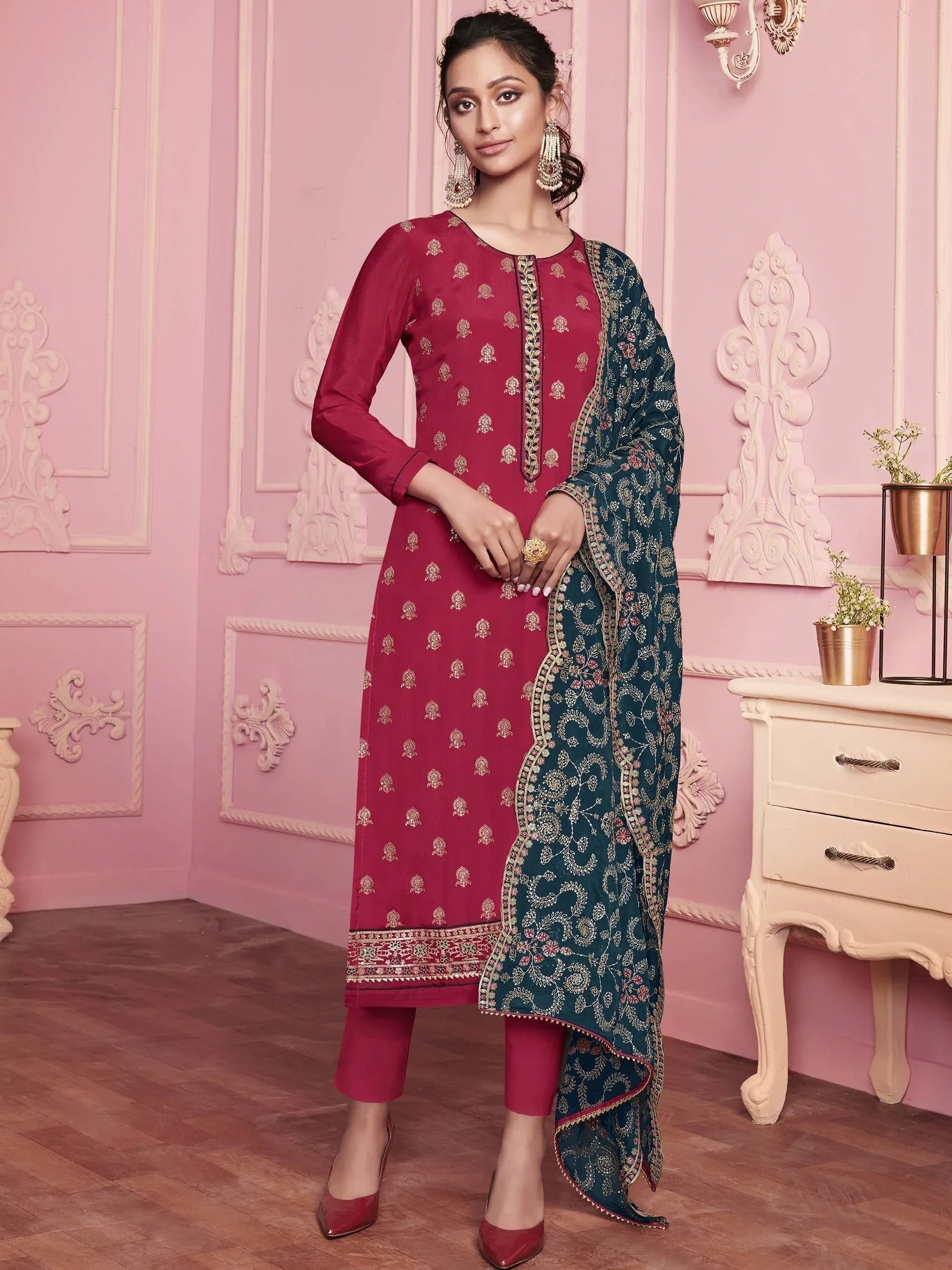Woman in maroon embroidered salwar kameez with blue dupatta, traditional Indian ethnic wear