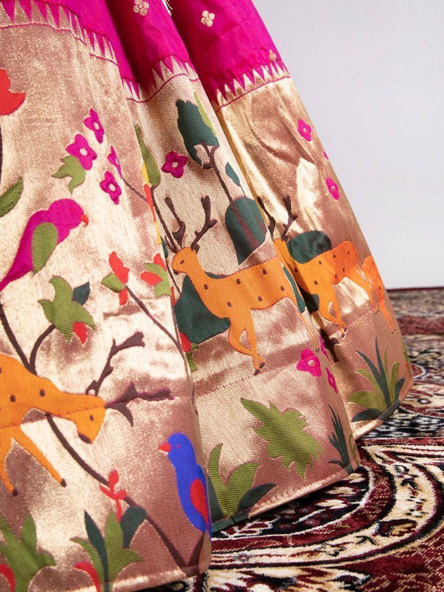 Ethnic lehenga with deer and bird print, gold base, pink border, floral motifs, traditional Indian wear